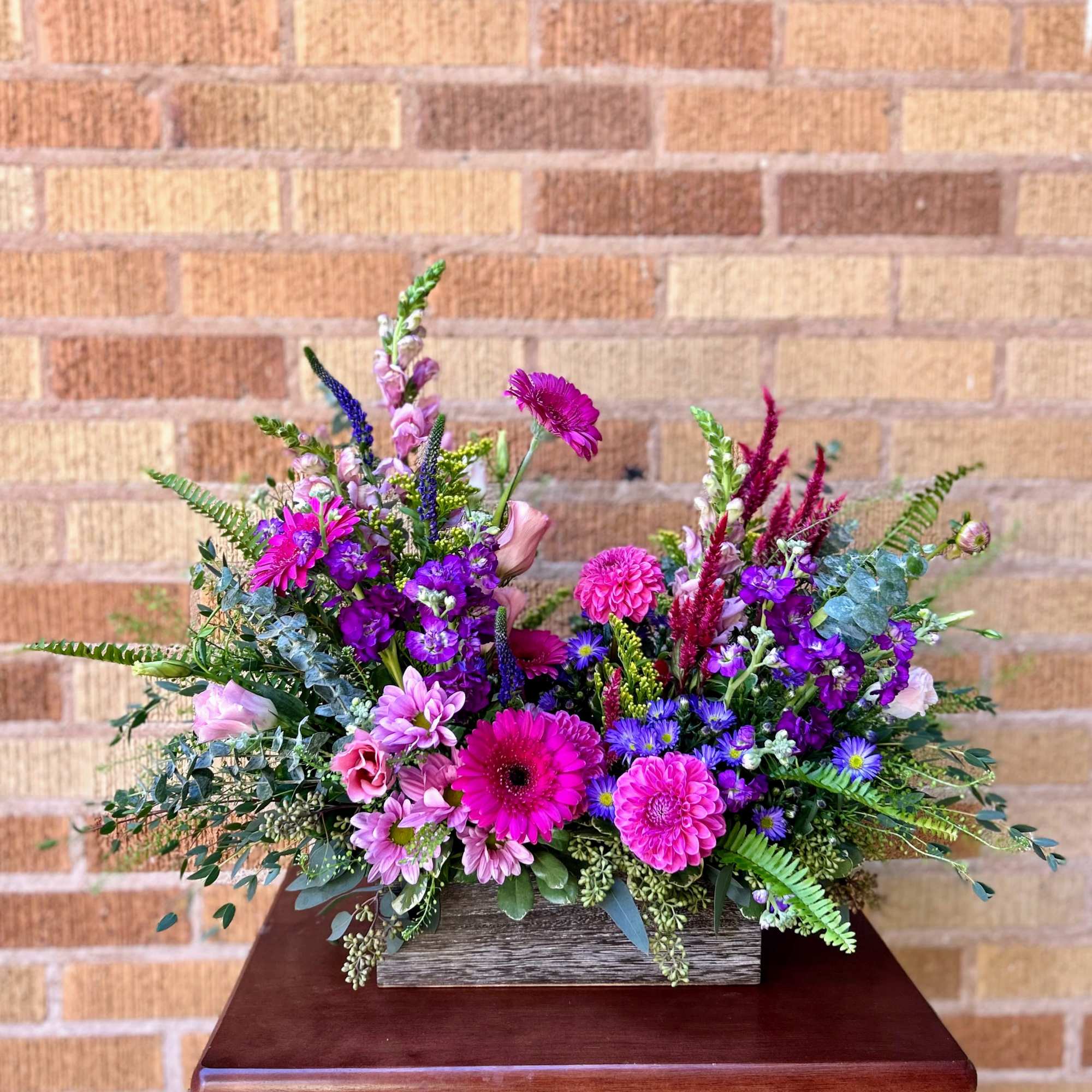 Transport yourself to the French countryside with our Parisian Prairie floral arrangement.