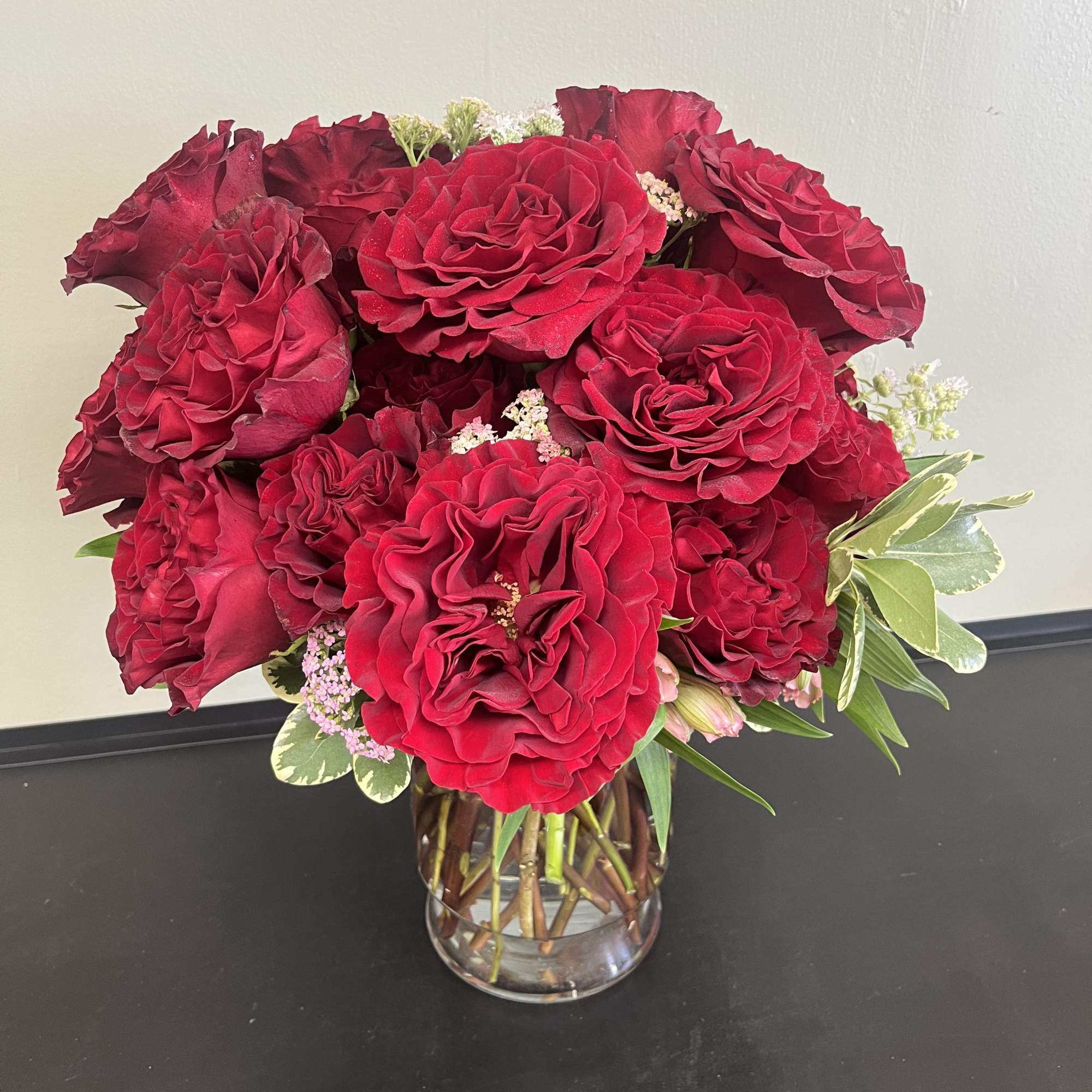 Bouquet of red roses in a clear glass vase