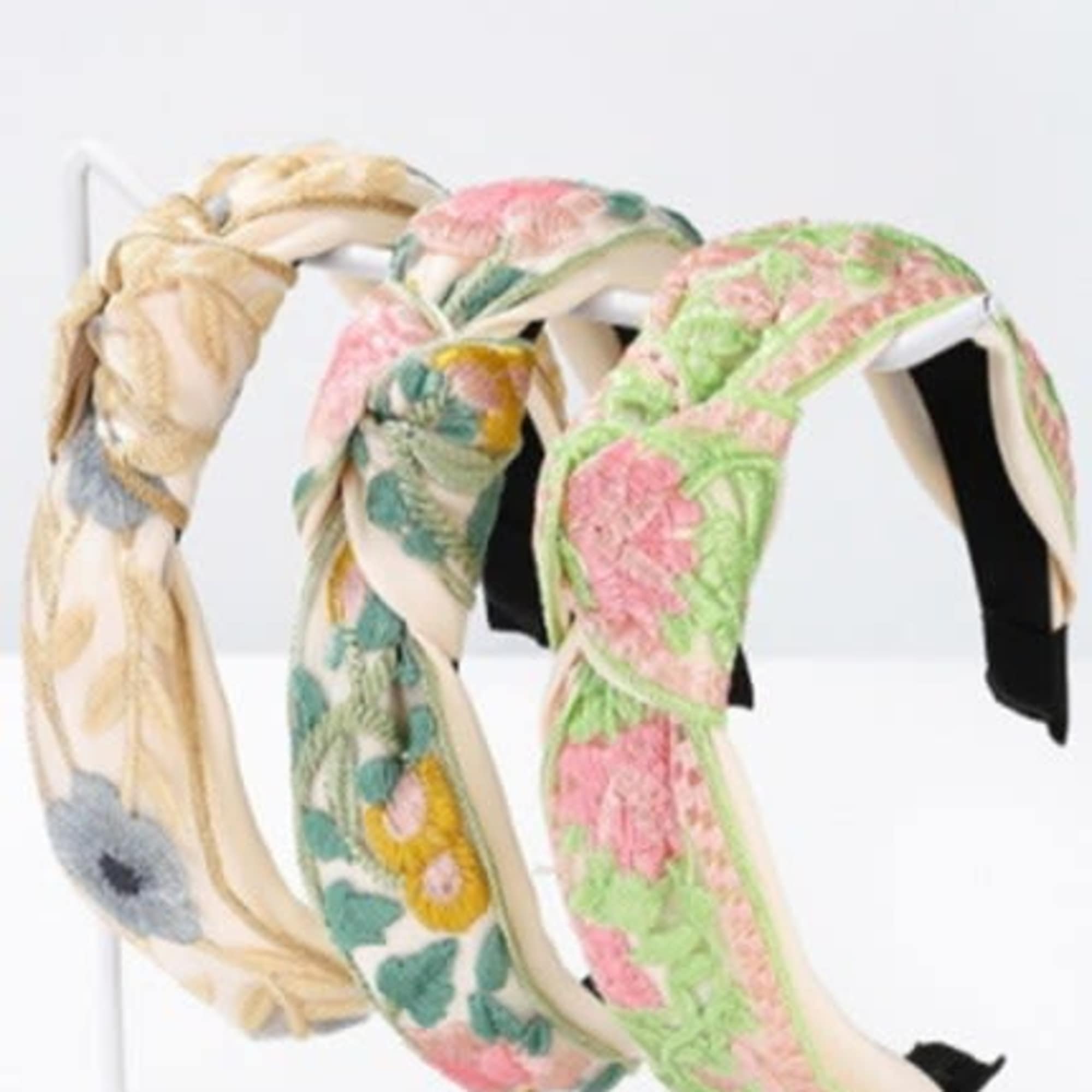 A vintage charm with this floral embroidery headband. Featuring delicate stitched floral