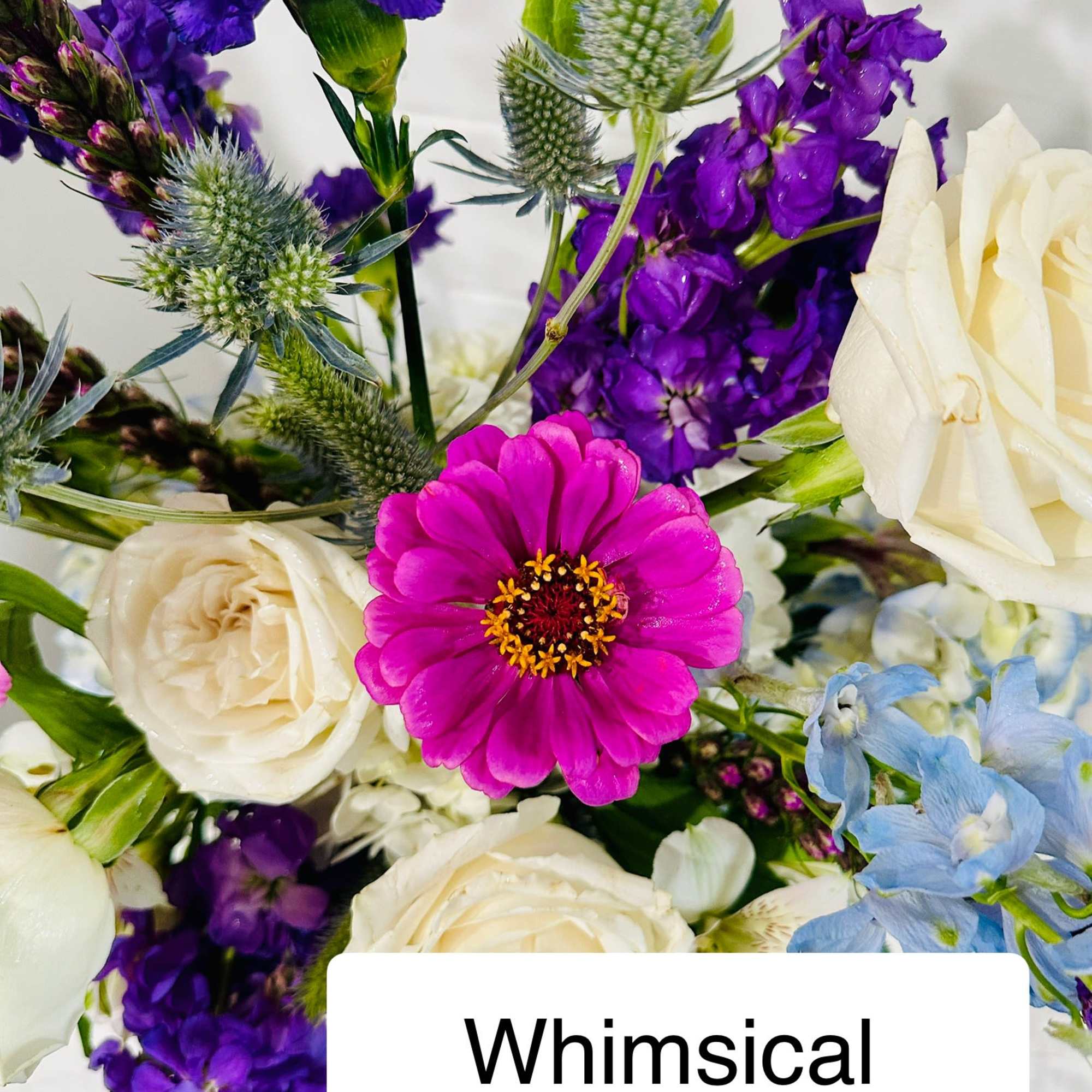 Mixed bouquet with purple, white, pink, and blue flowers