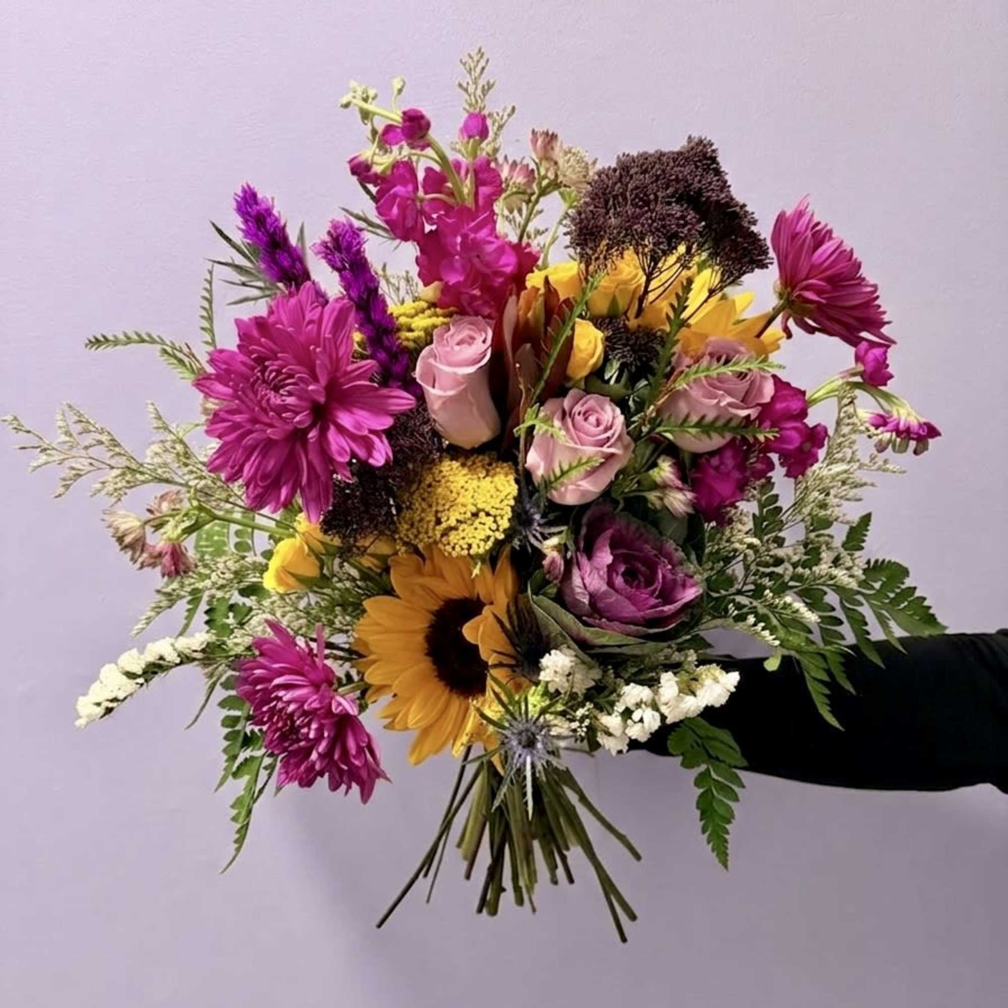 A vibrant, textured arrangement that captures the wild elegance of a Southern