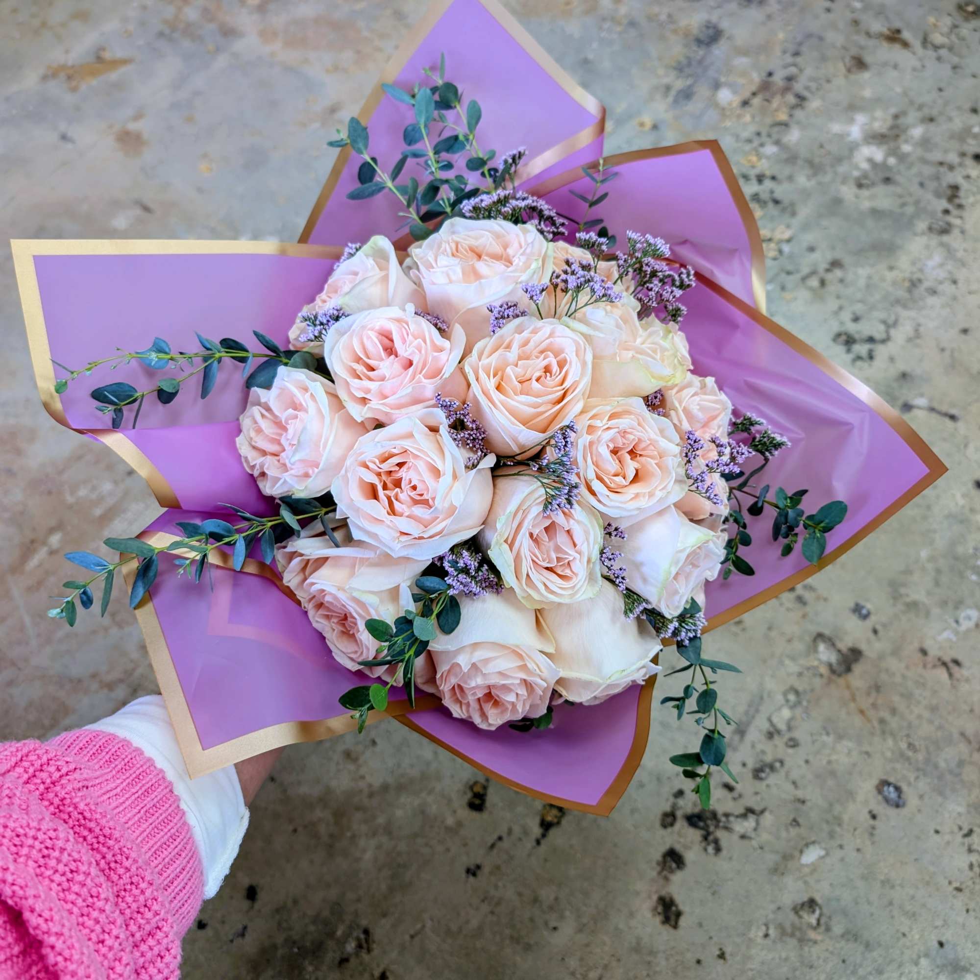 Bouquet of pale pink roses wrapped in purple paper, photo 3 of 3