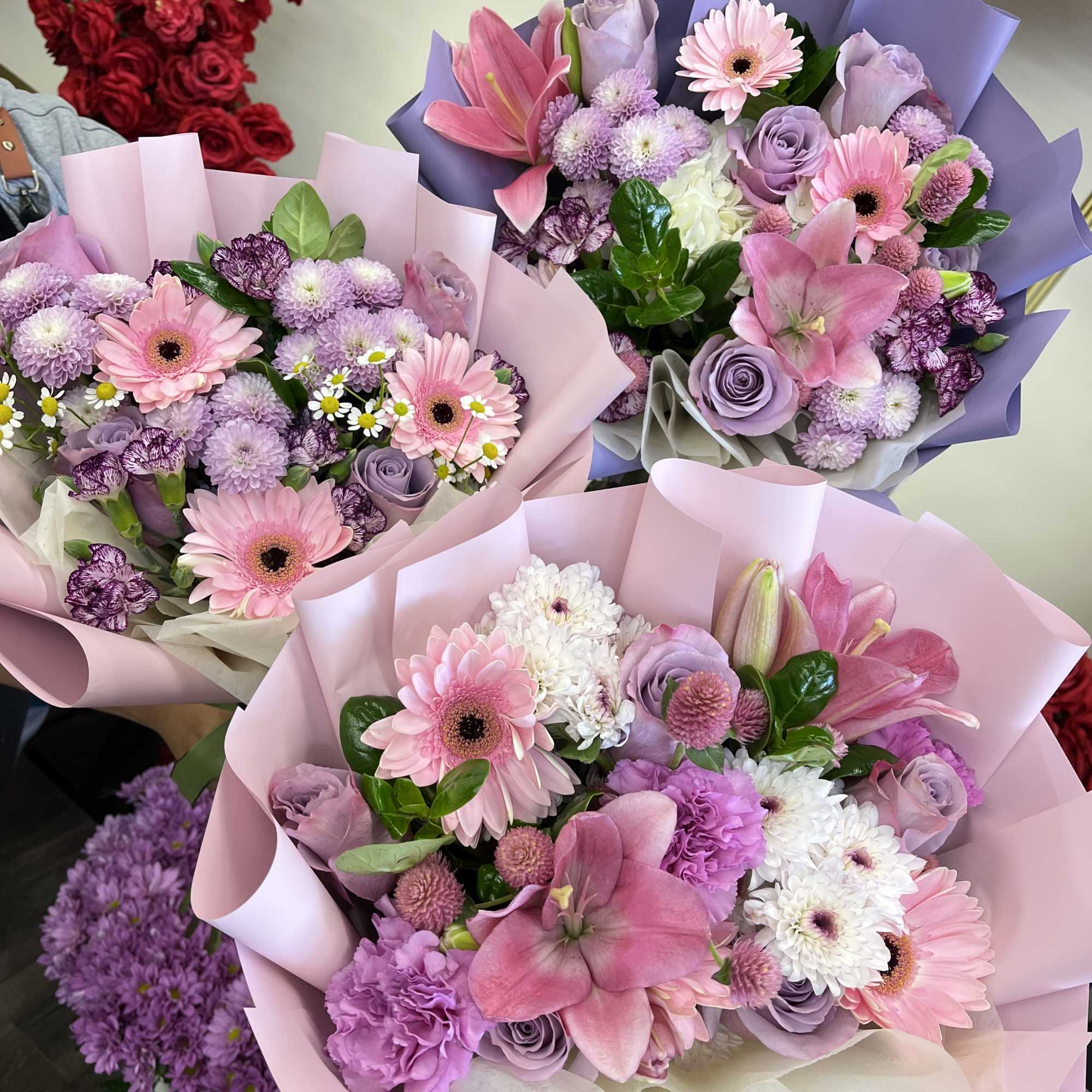 Florist, choice Pink and lavender bouquet mix of gerbera, roses, lilies and