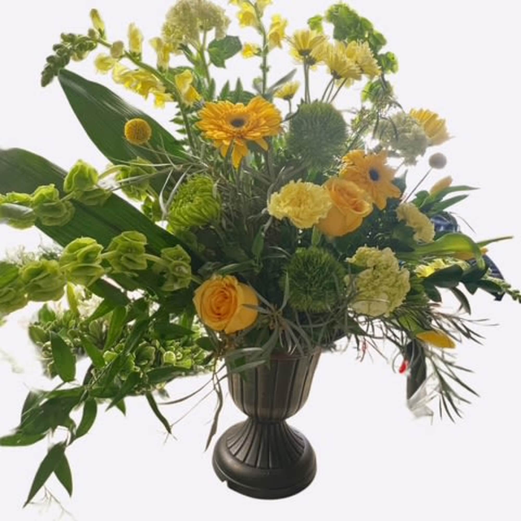 Yellow and green floral arrangement in a dark urn vase, photo 2 of 2
