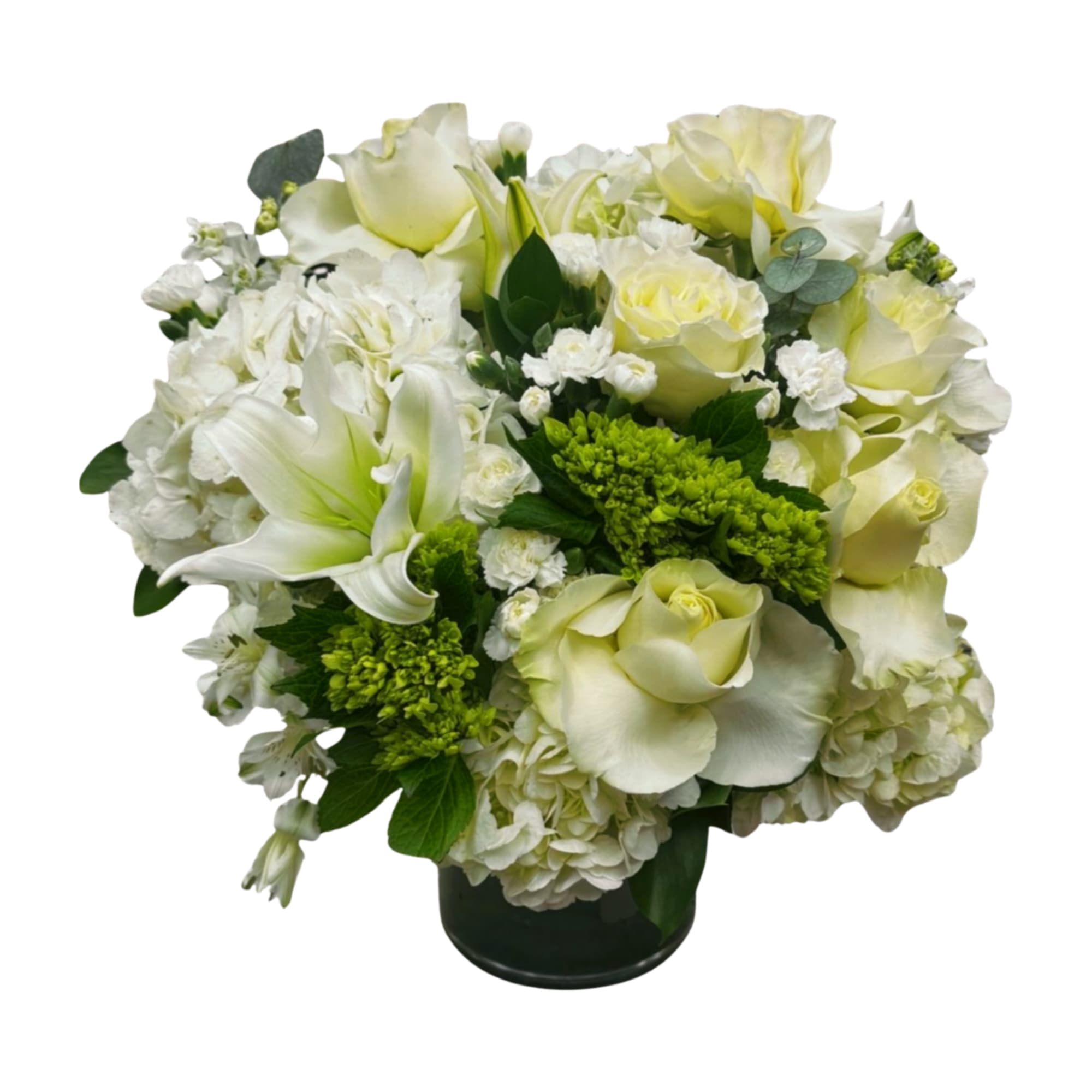 A soft, timeless mix of white roses, lilies, hydrangea, and lush greenery