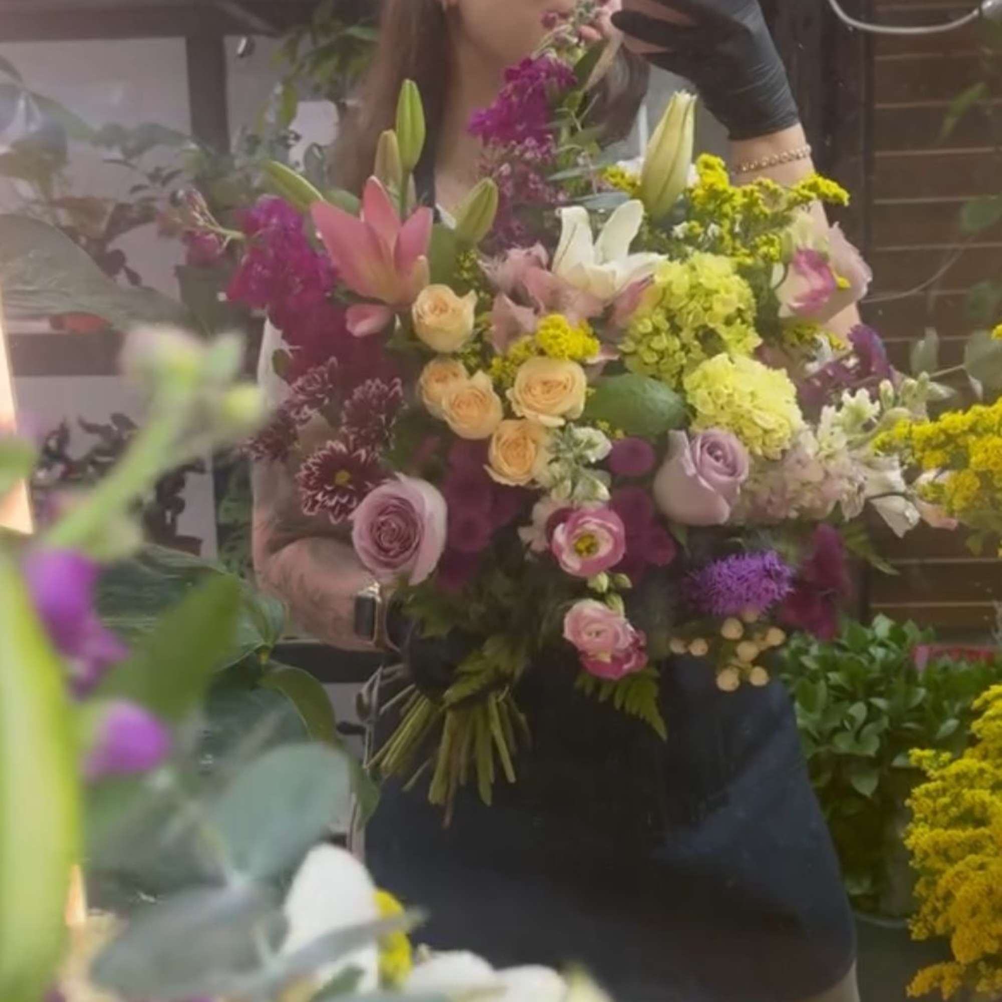 Large mixed bouquet with lilies, roses, and purple flowers