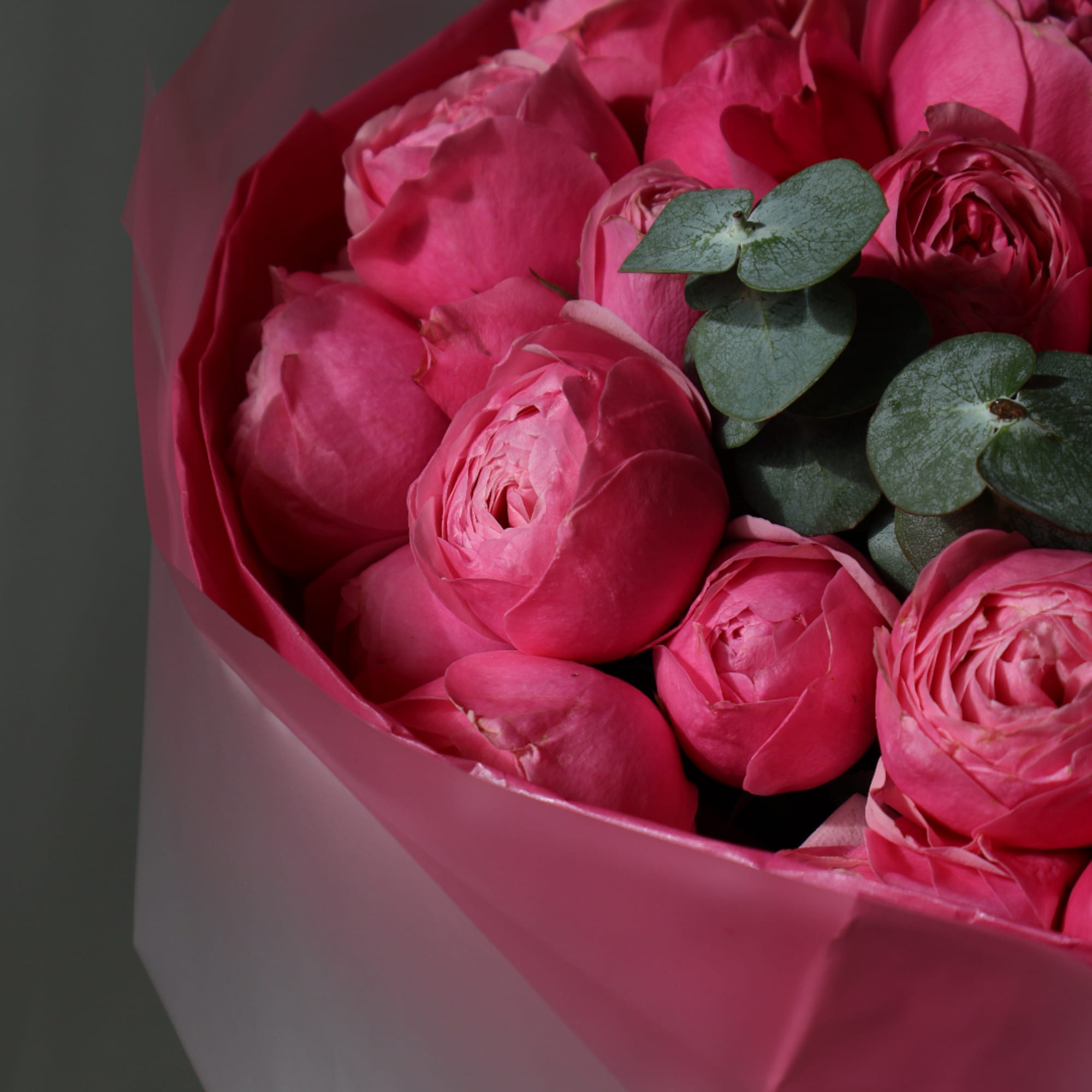 Pink ranunculus bouquet wrapped in pink paper