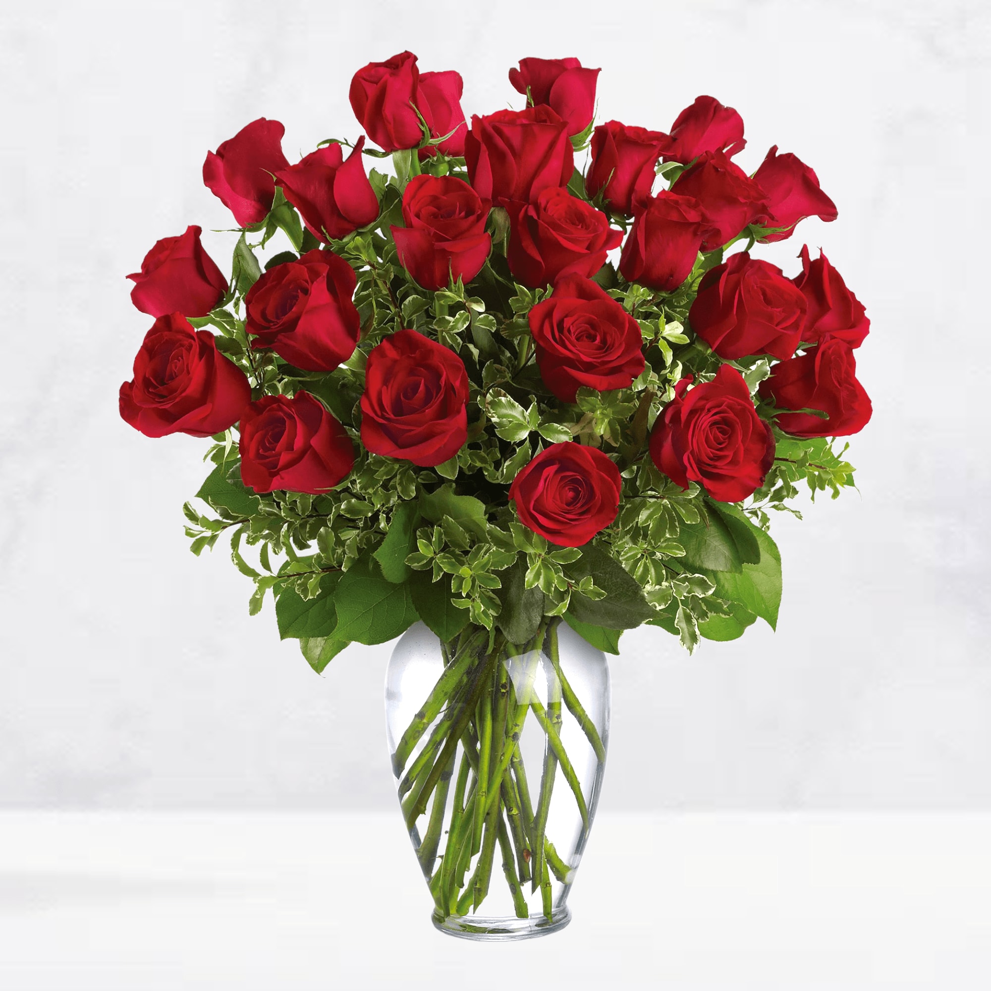 Bouquet of red roses in a clear glass vase