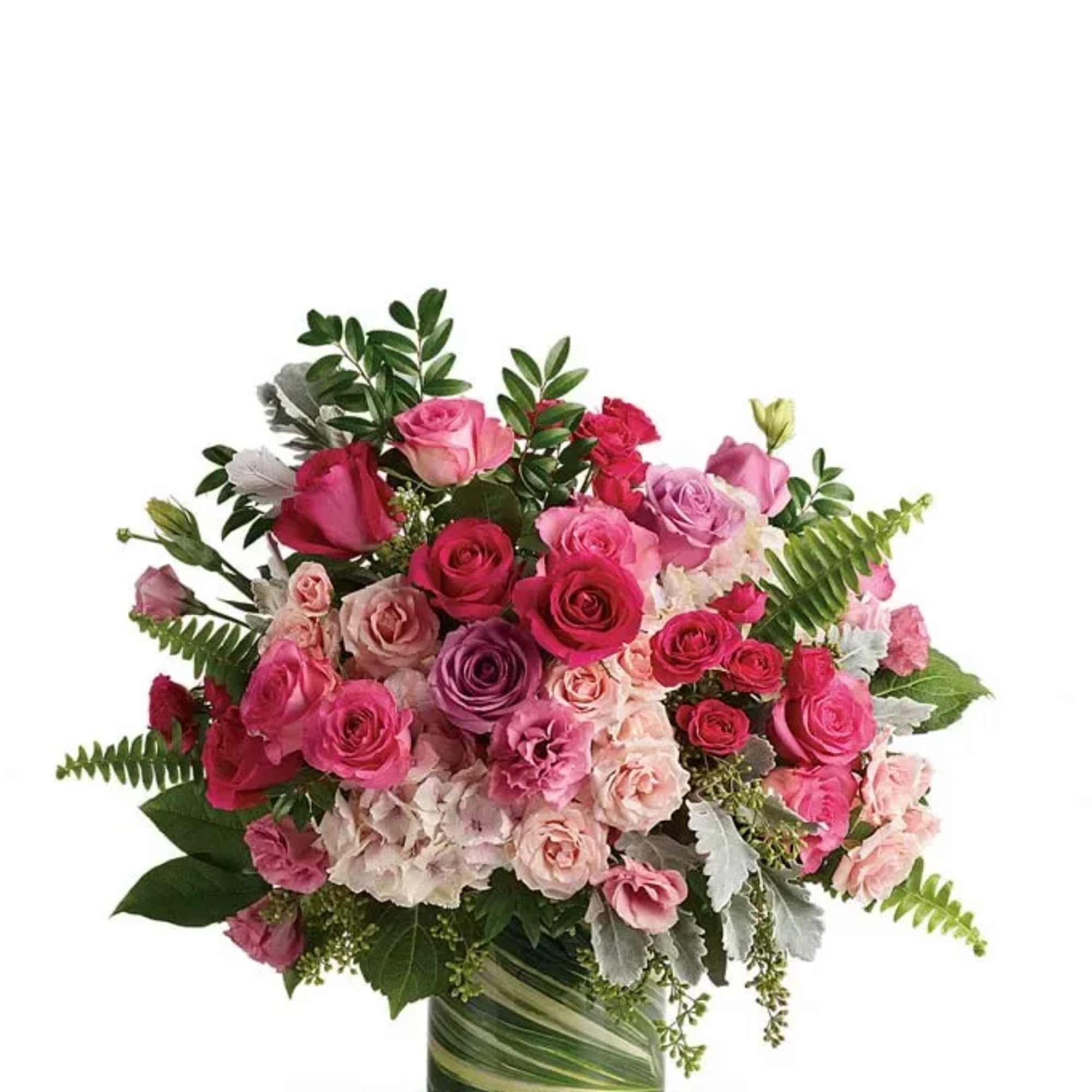 Bouquet of pink and purple roses in a glass vase