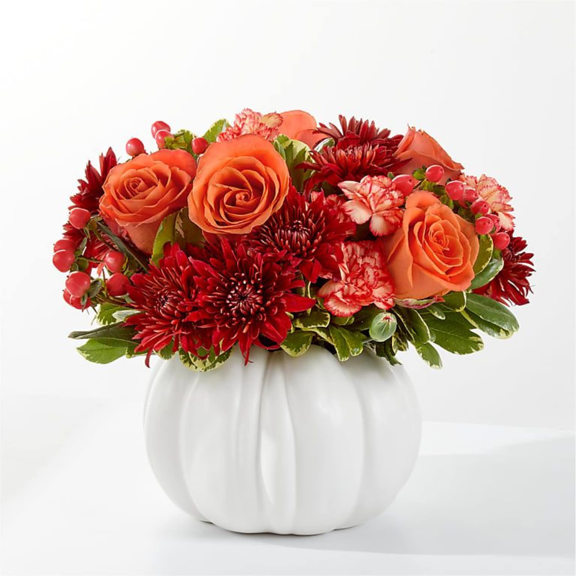 Embrace the crisp, golden energy of fall with this stunning seasonal arrangement.