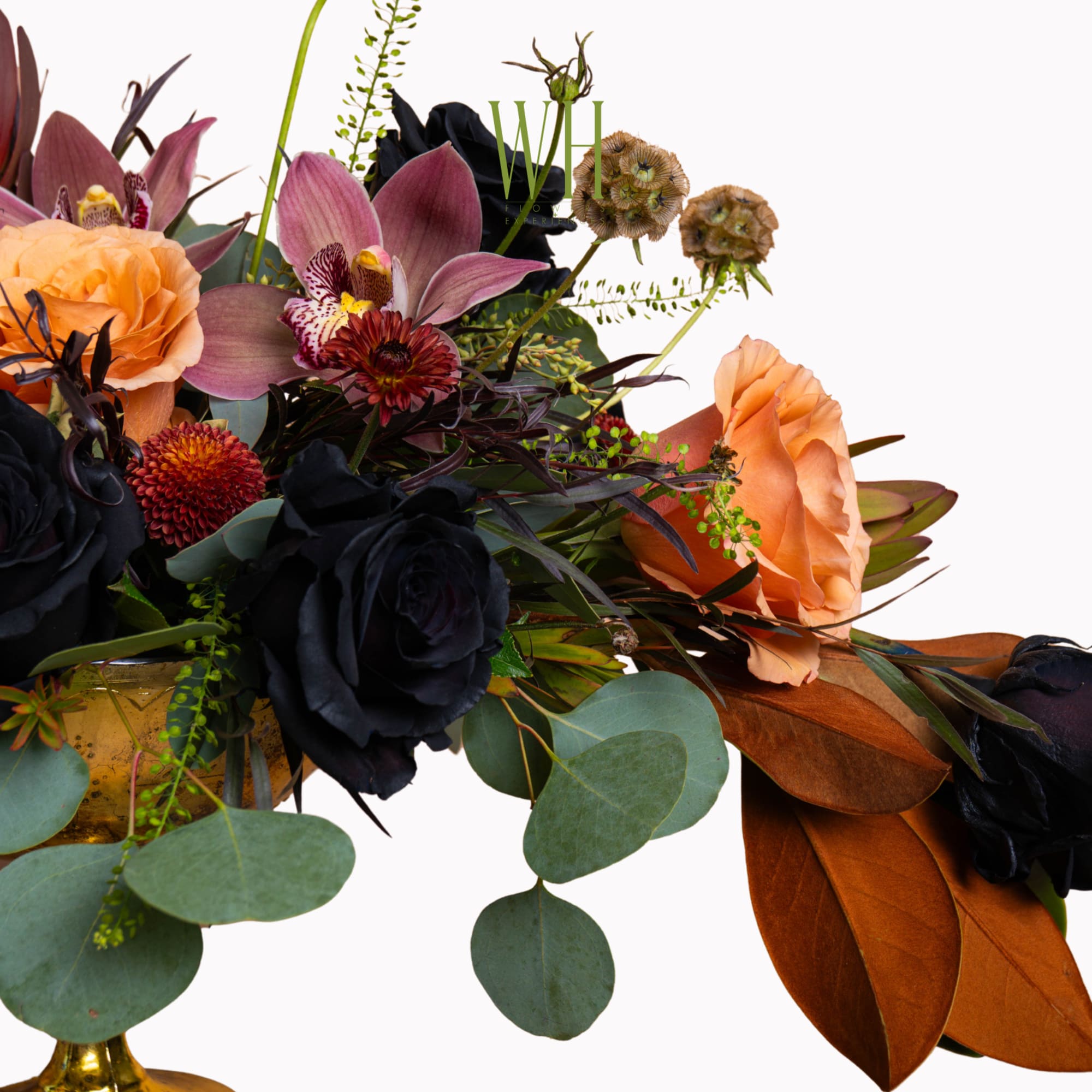 Bouquet of dark roses, orchids, and peach blooms with eucalyptus