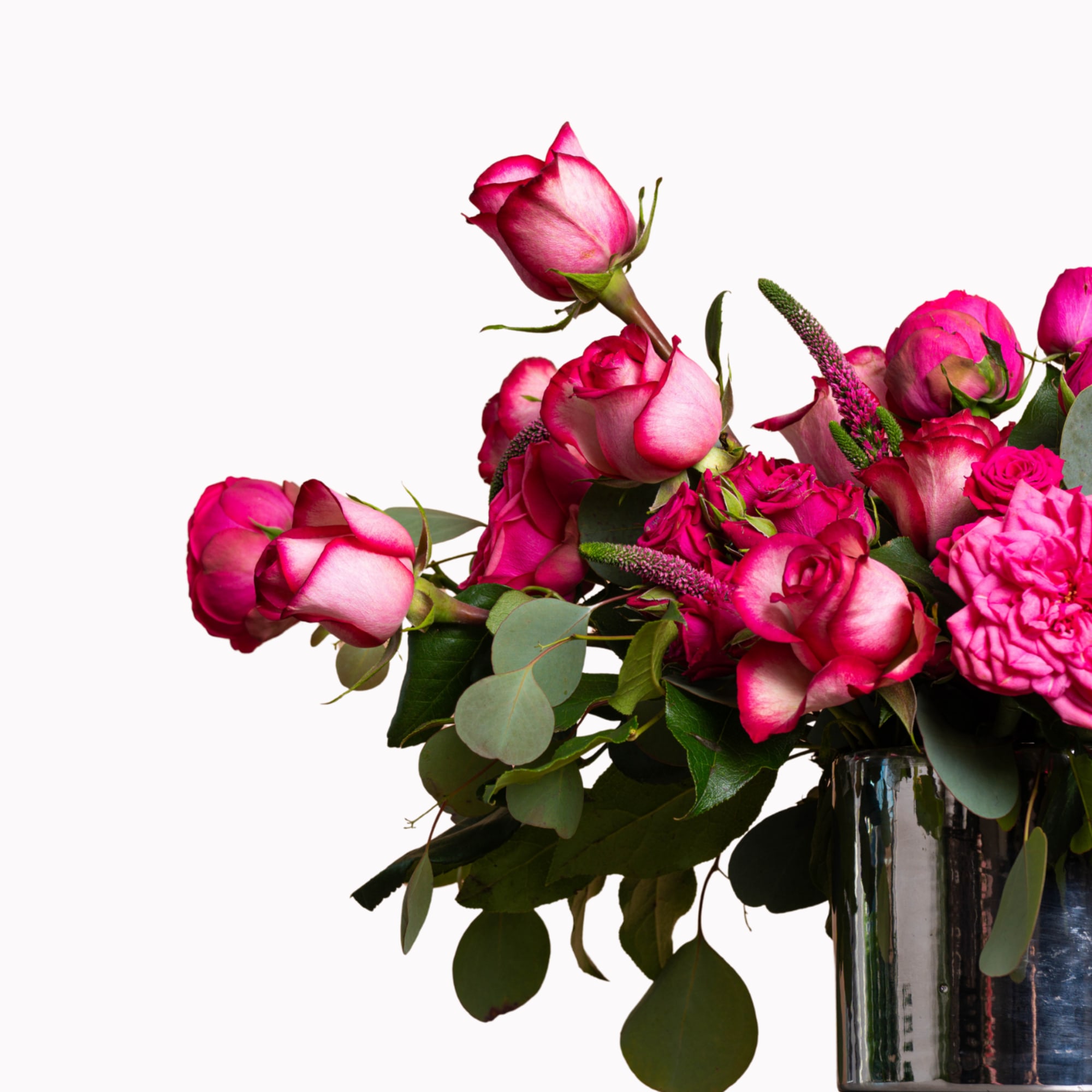 Pink roses arranged in a glass vase