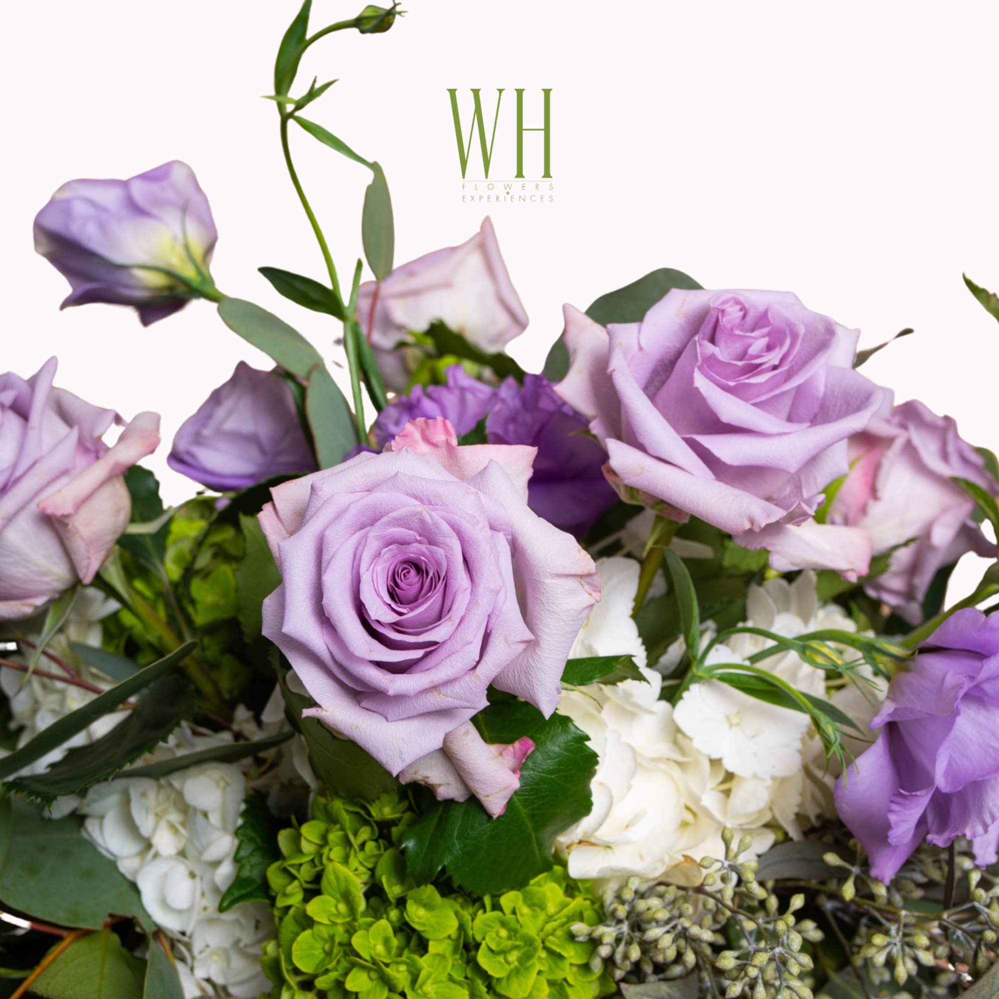 Lavender roses and white hydrangeas in a mixed bouquet
