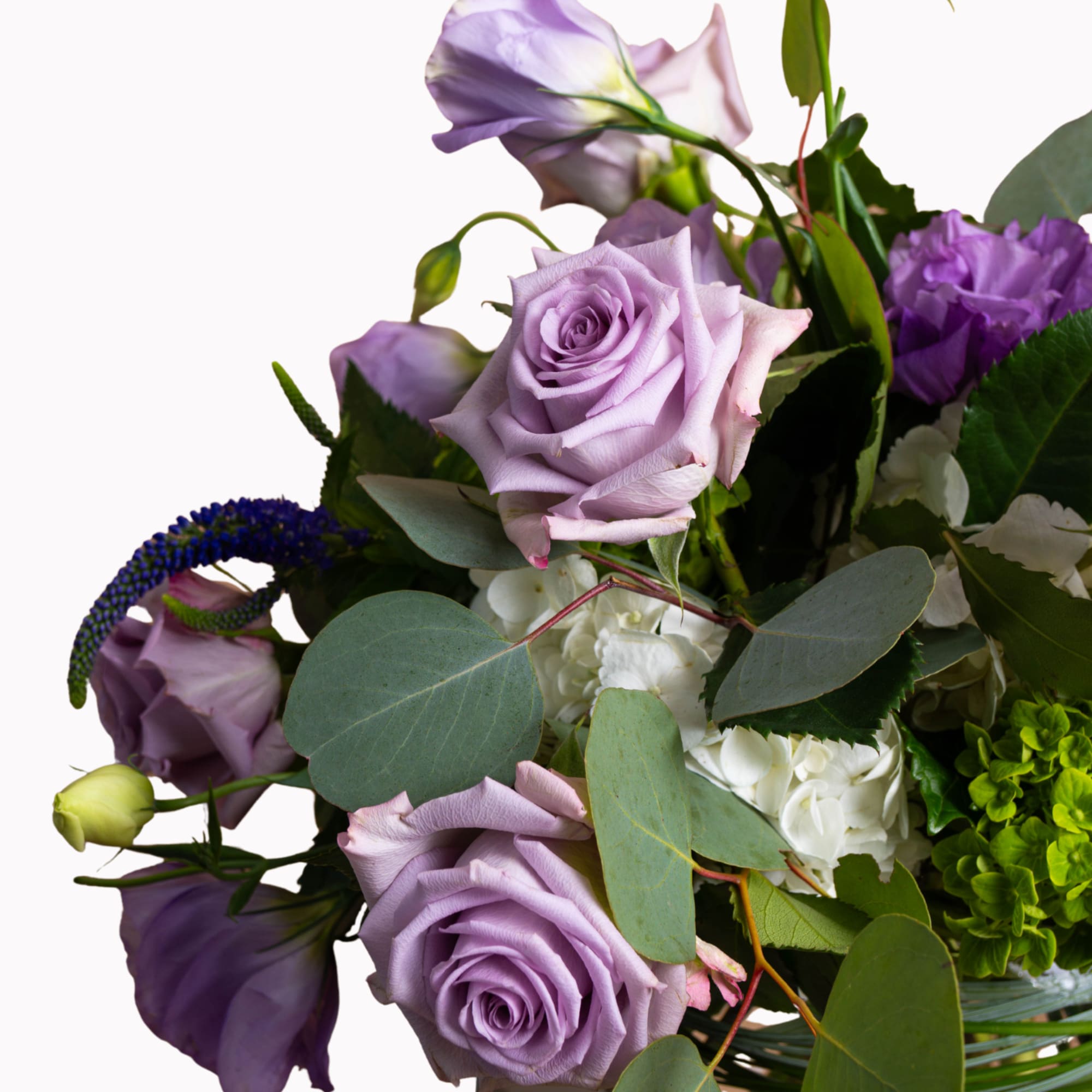 Bouquet of lavender roses and purple blooms with white flowers