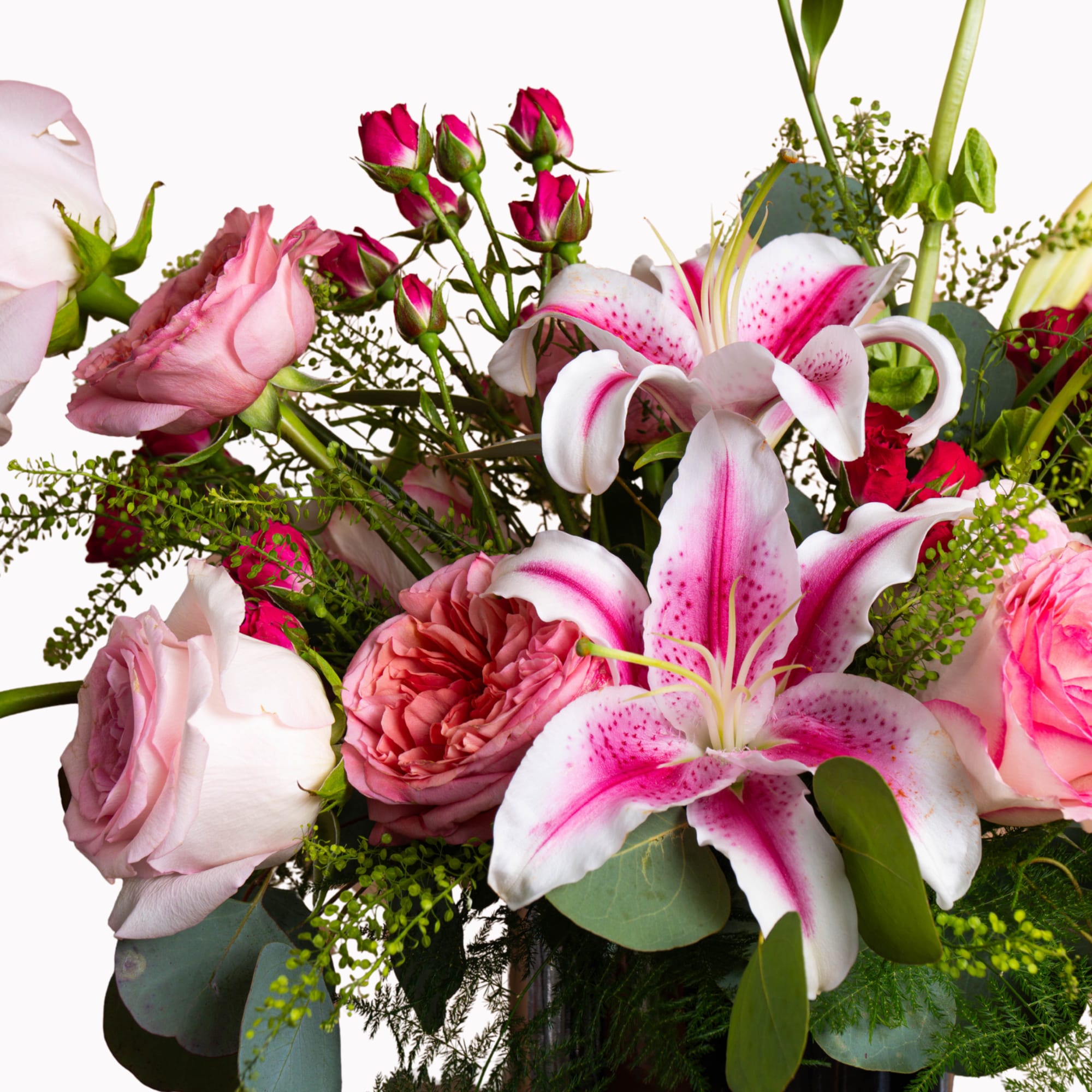 Pink roses and white-pink lilies in a mixed bouquet