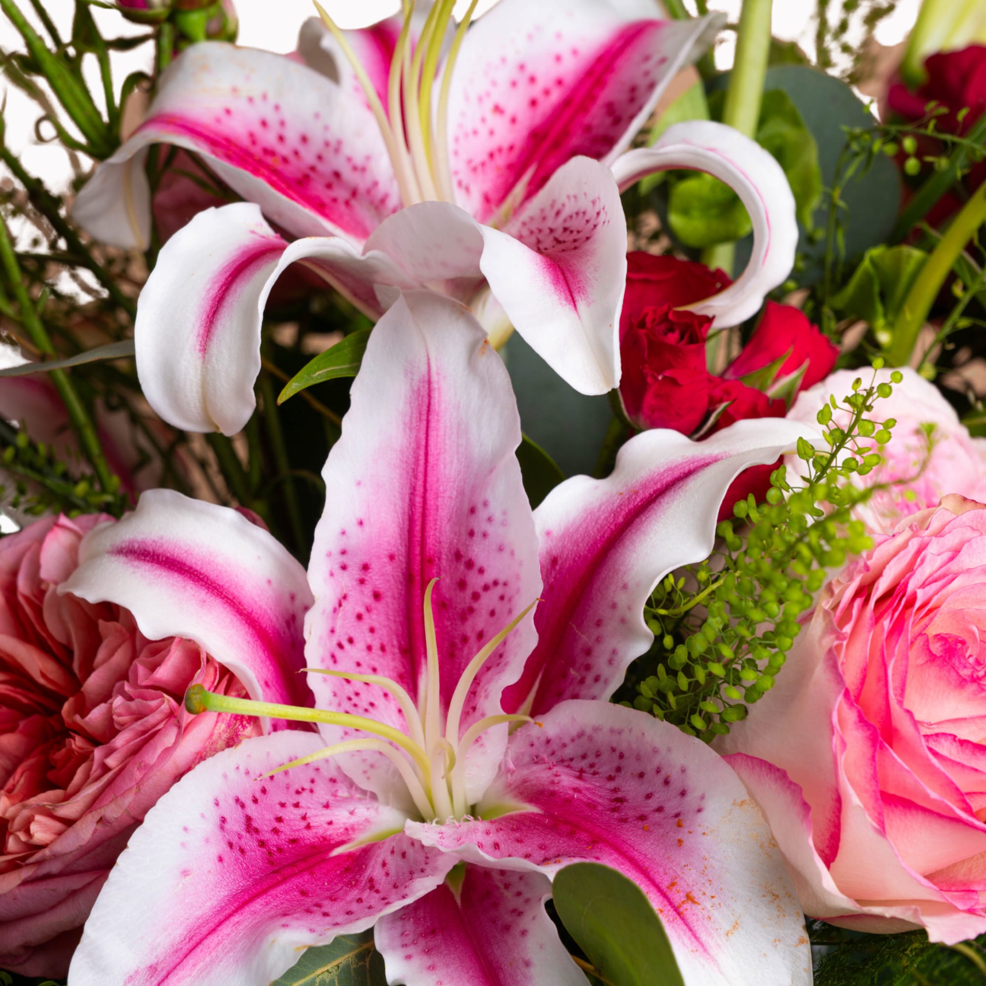 Bouquet of pink and white lilies with roses