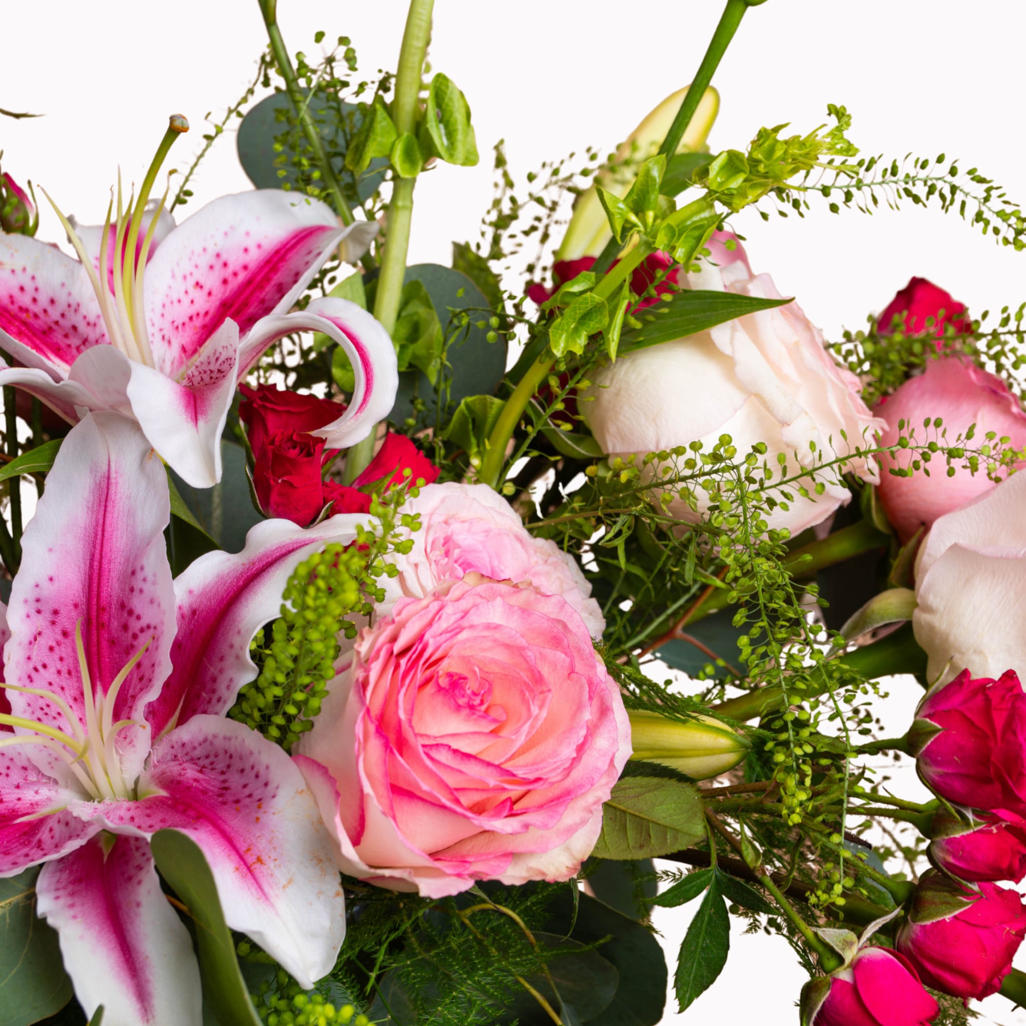 Bouquet of pink lilies and roses with green filler