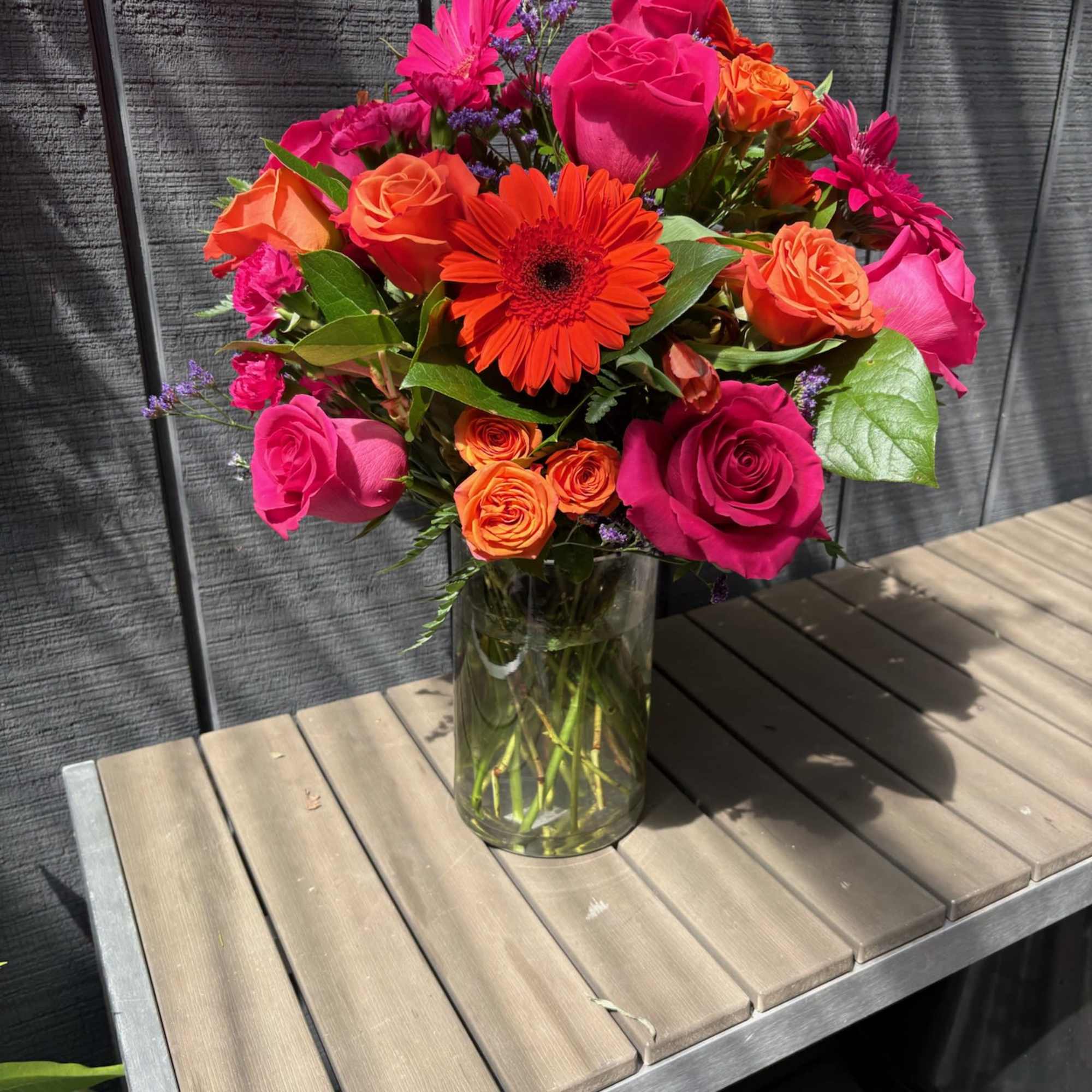 A bold burst of color-this birthday bouquet blends vivid orange and hot