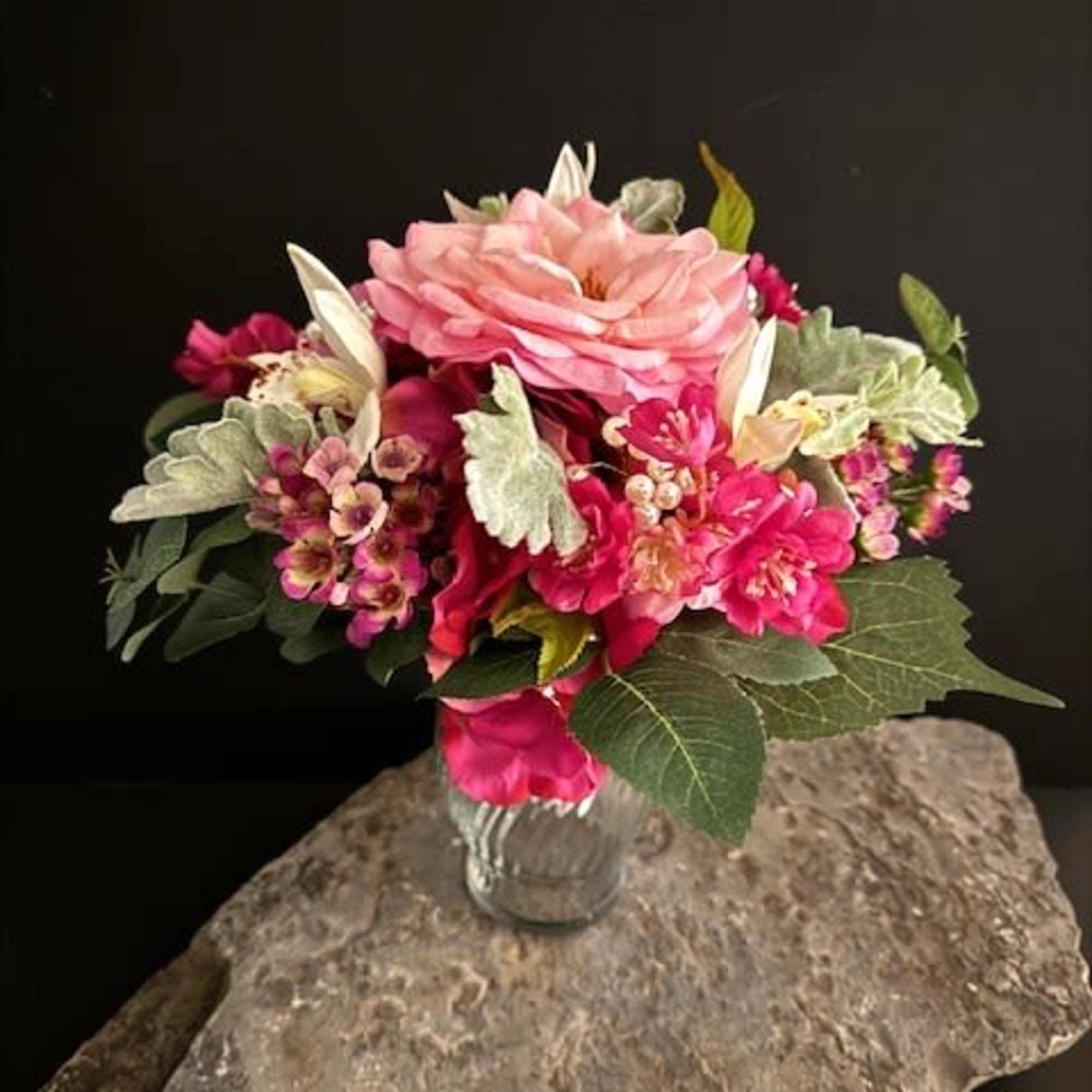 A lush, hand-held fuchsia hydrangea-style bouquet centered on a single large pink, photo 3 of 3