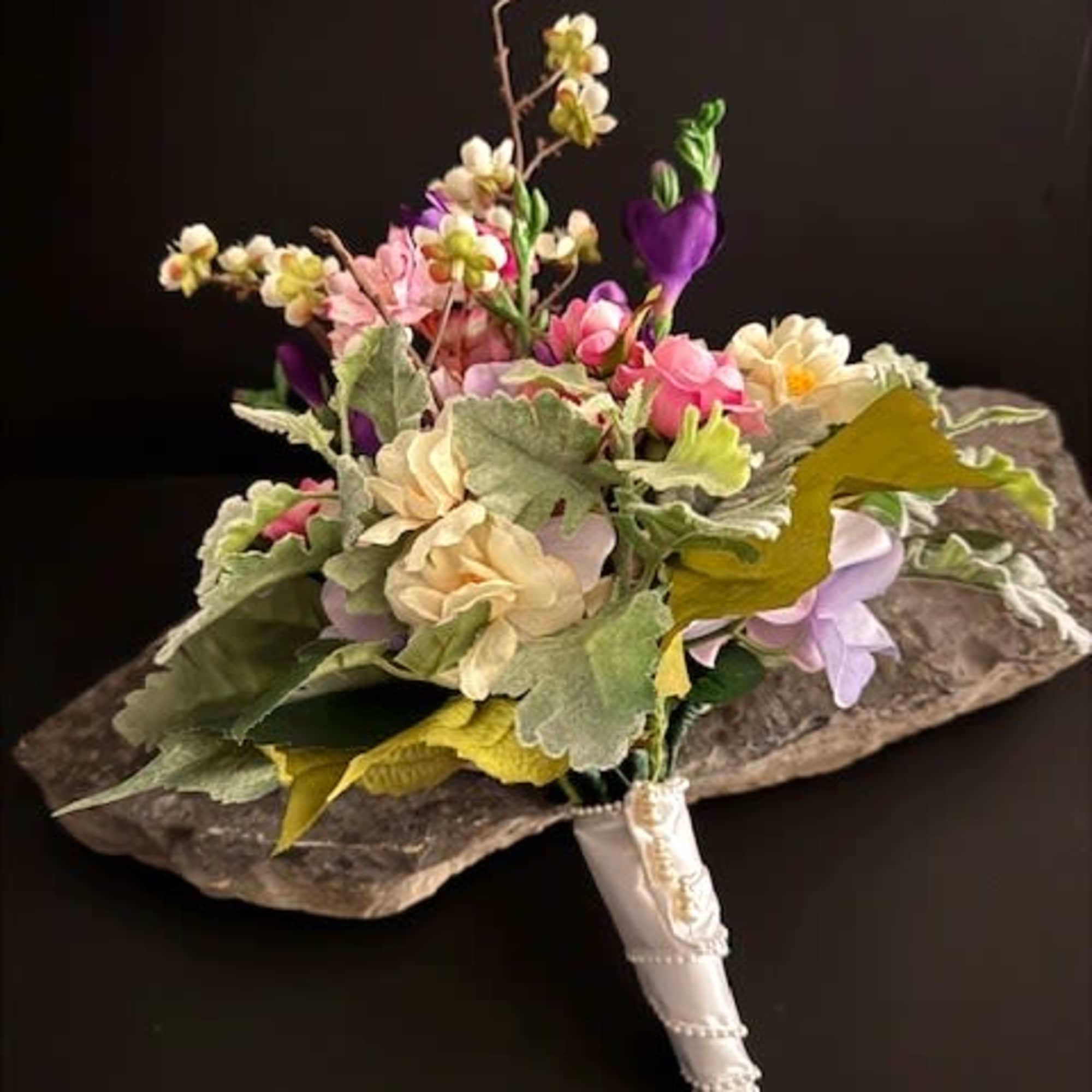 A compact dome of soft pink, cream, lavender and purple silk blooms, photo 3 of 3