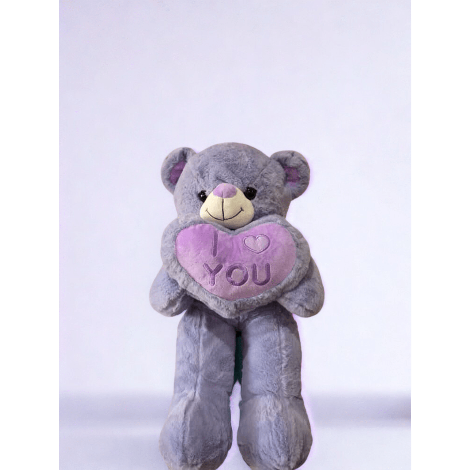 Gray teddy bear holding a purple heart with "I ♥ YOU" text