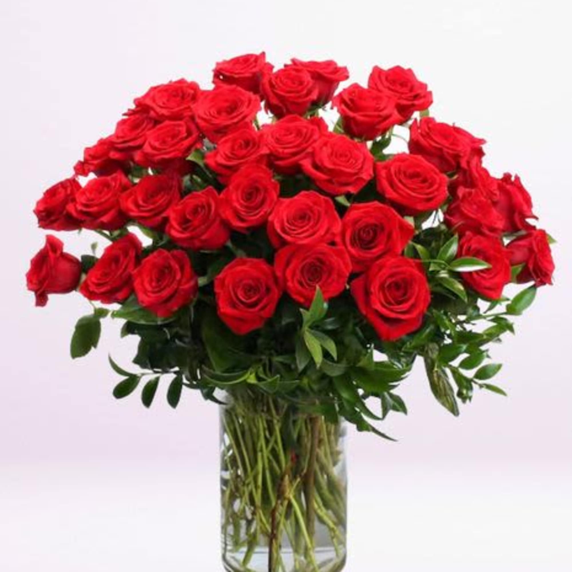 Bouquet of red roses in a clear glass vase