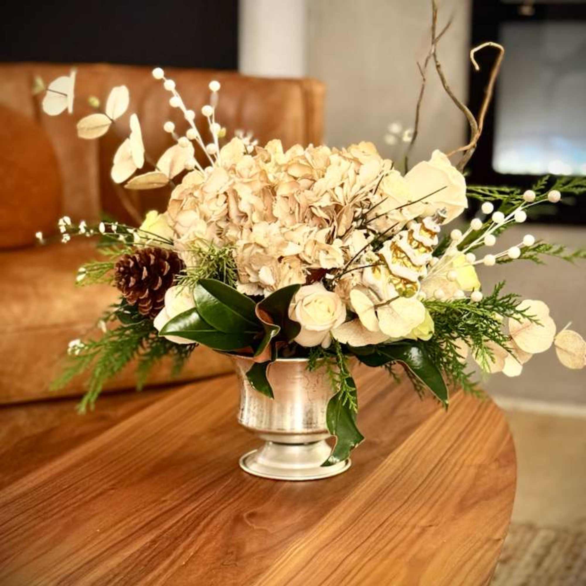 WEB

Our Neutral Winter Elegance Floral Arrangement is a refined seasonal design created