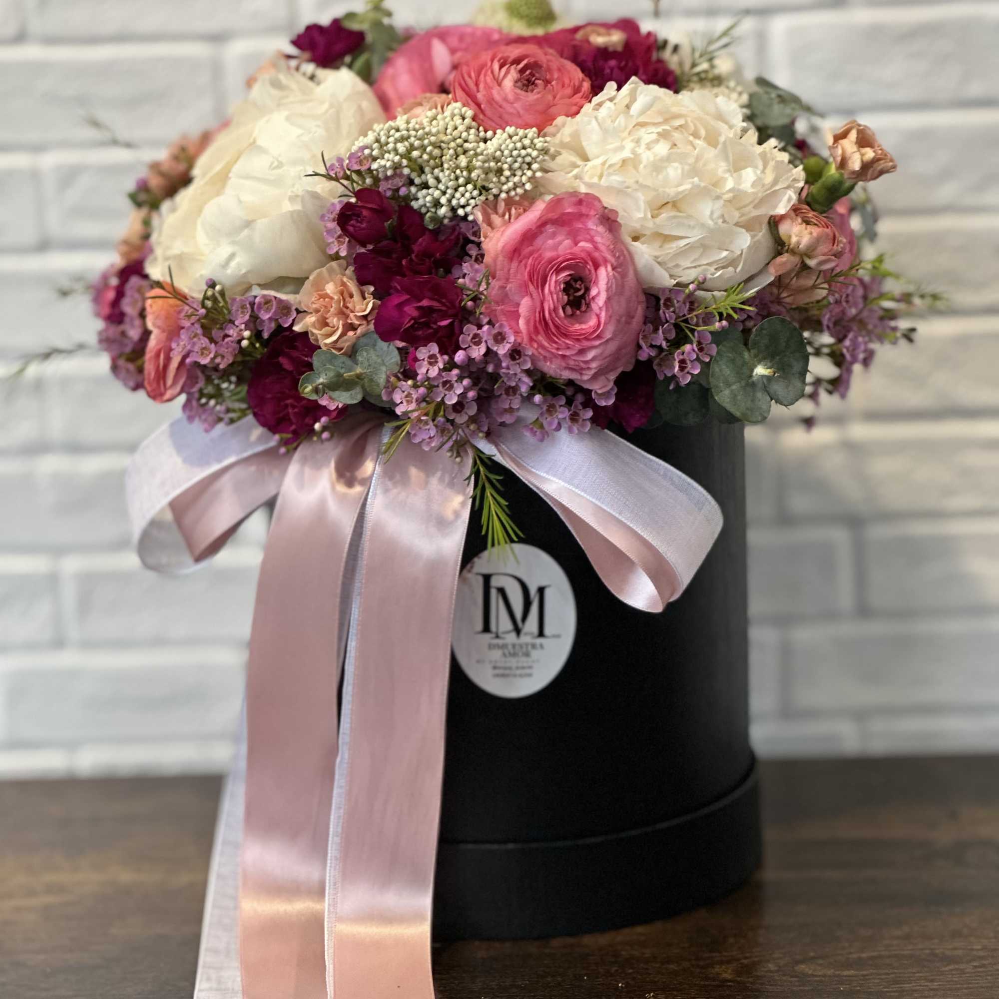 This exquisite floral arrangement is designed in a matte black flower box, photo 2 of 3