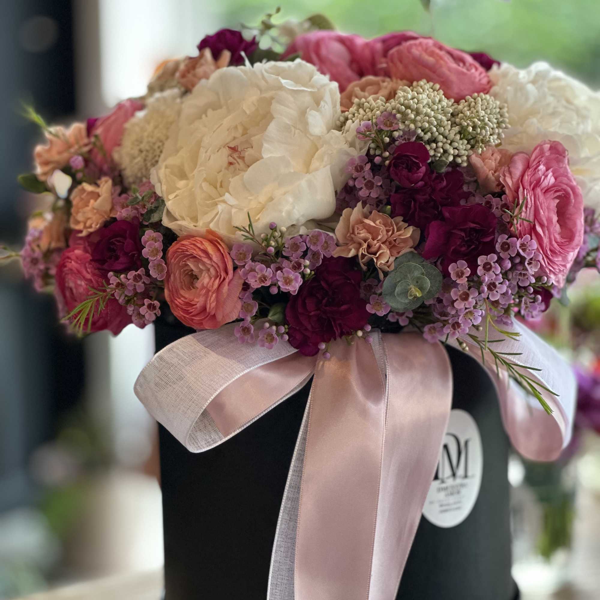 This exquisite floral arrangement is designed in a matte black flower box