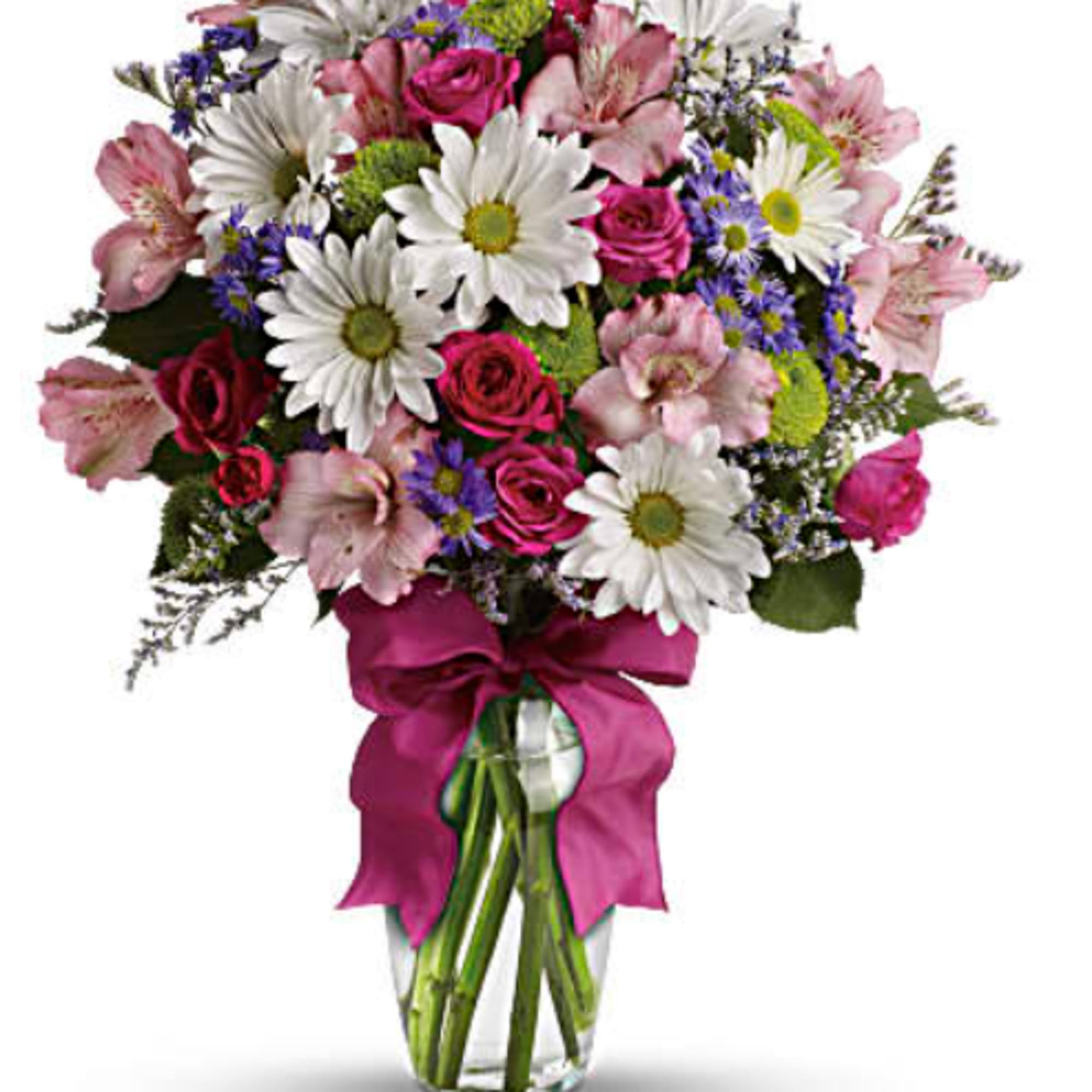 Mixed bouquet of pink roses, daisies, and alstroemeria in a glass vase