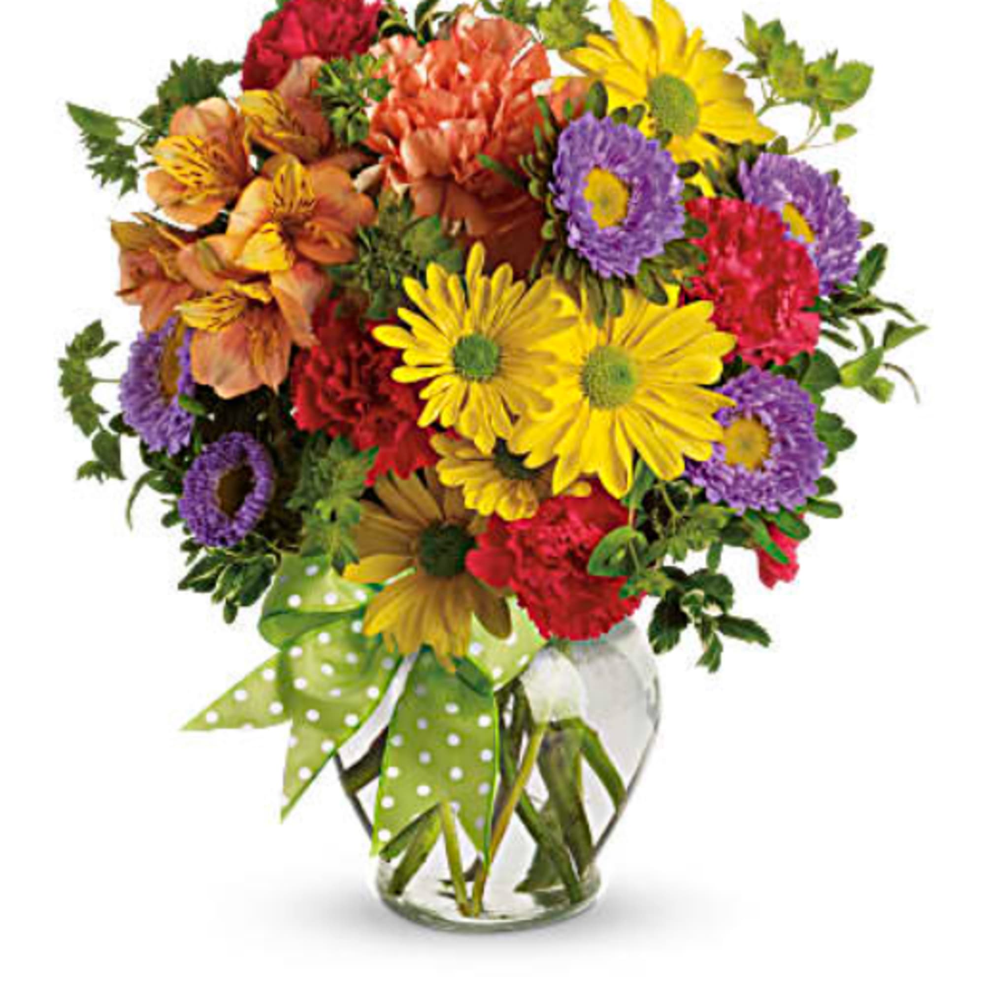 Mixed bouquet of colorful flowers in a clear glass vase with a green polka-dot ribbon