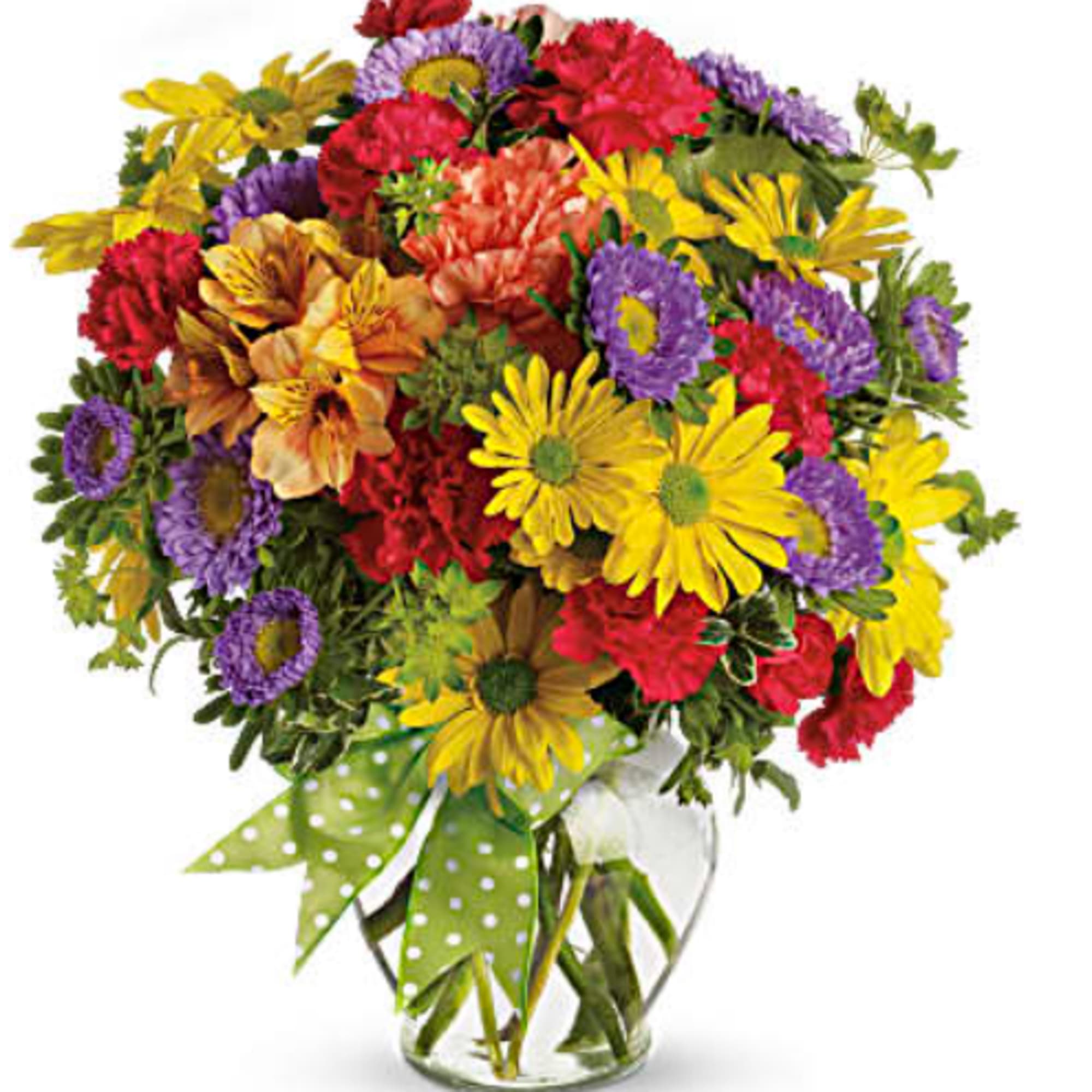 Colorful mixed bouquet in a clear glass vase with a polka-dot ribbon