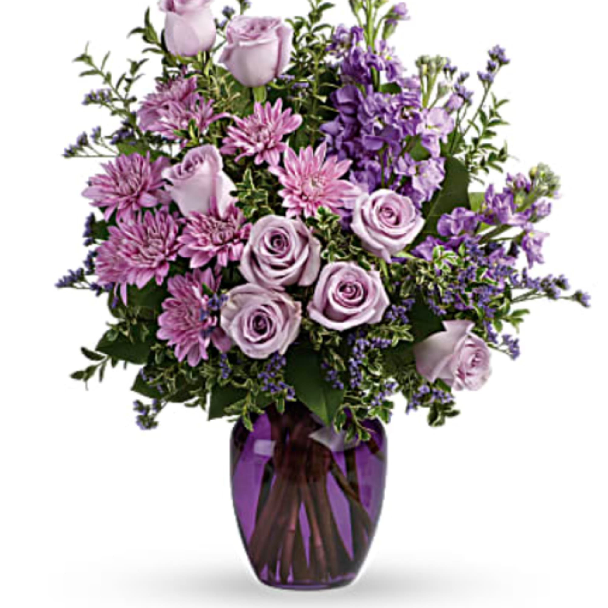 Lavender roses and purple flowers in a purple glass vase