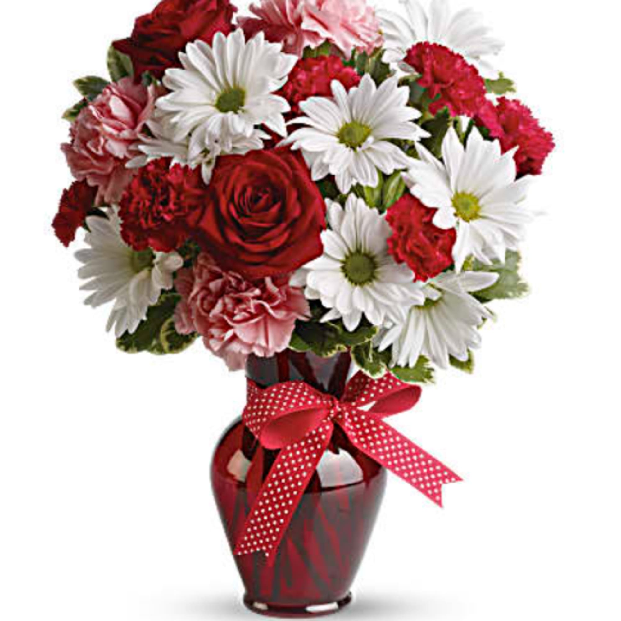 Bouquet of red roses, pink carnations, and white daisies in a red vase with a ribbon