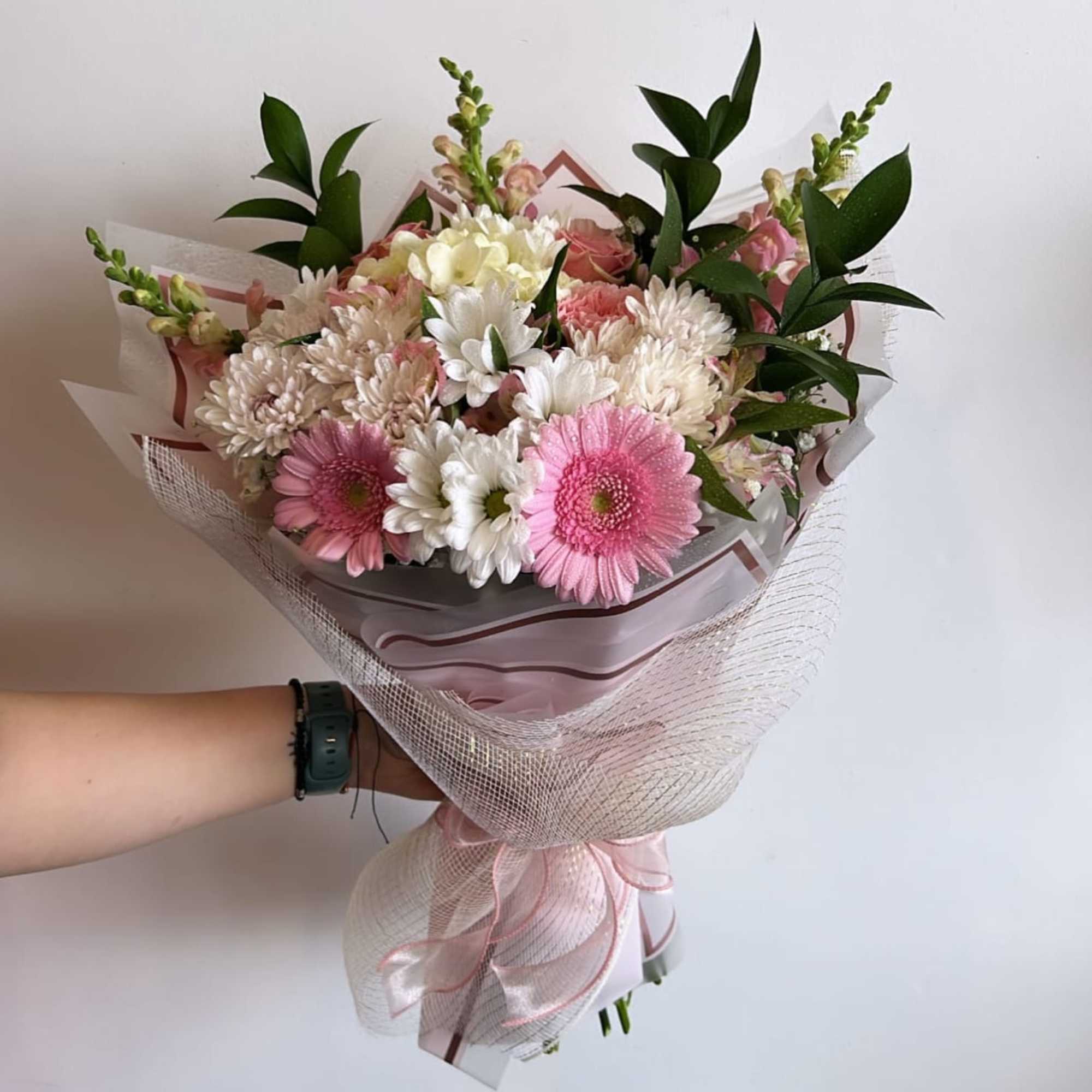 bouquets are never identical, but will have the same overall theme, wrapping