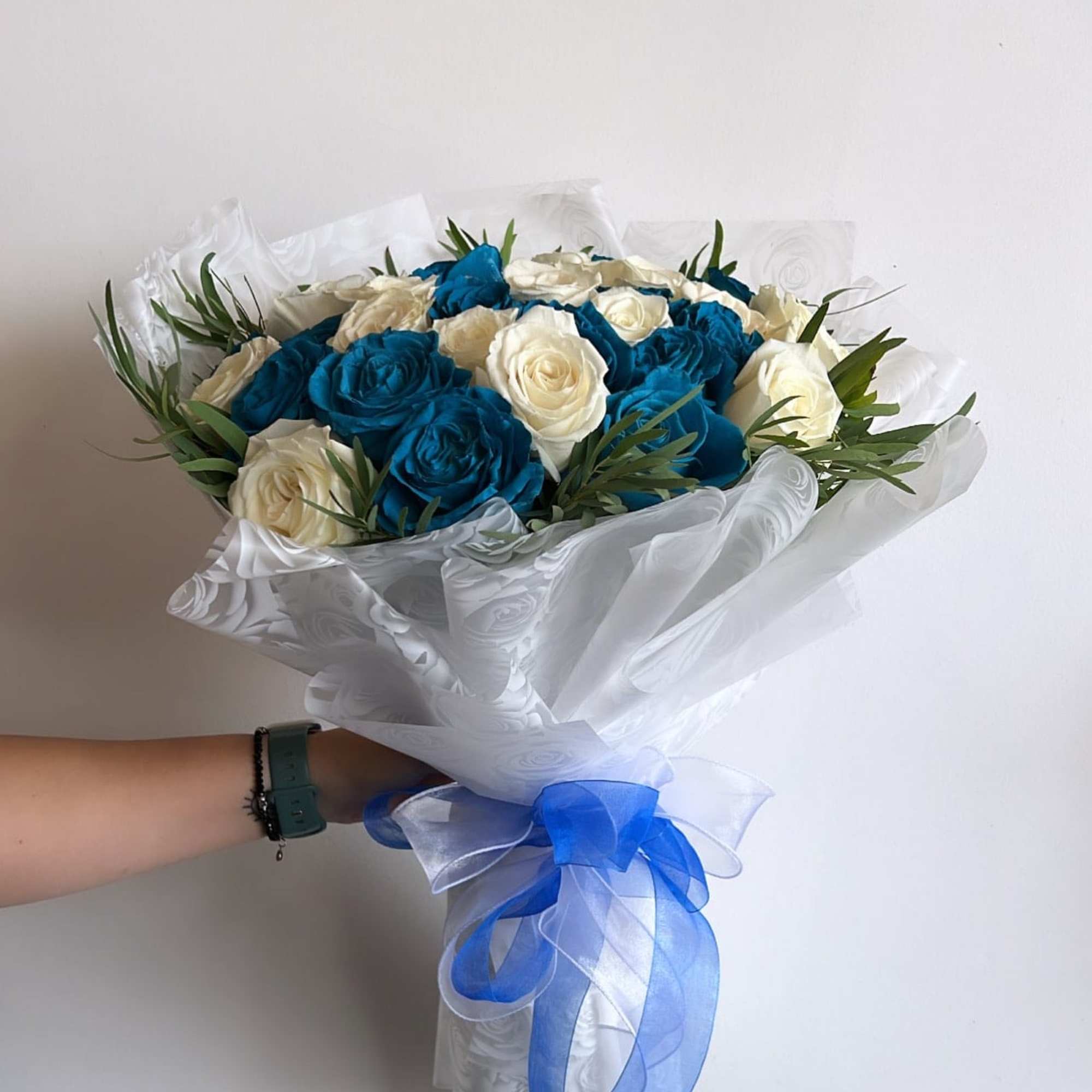Bouquet of blue and white roses wrapped in white paper with a blue ribbon, photo 2 of 2