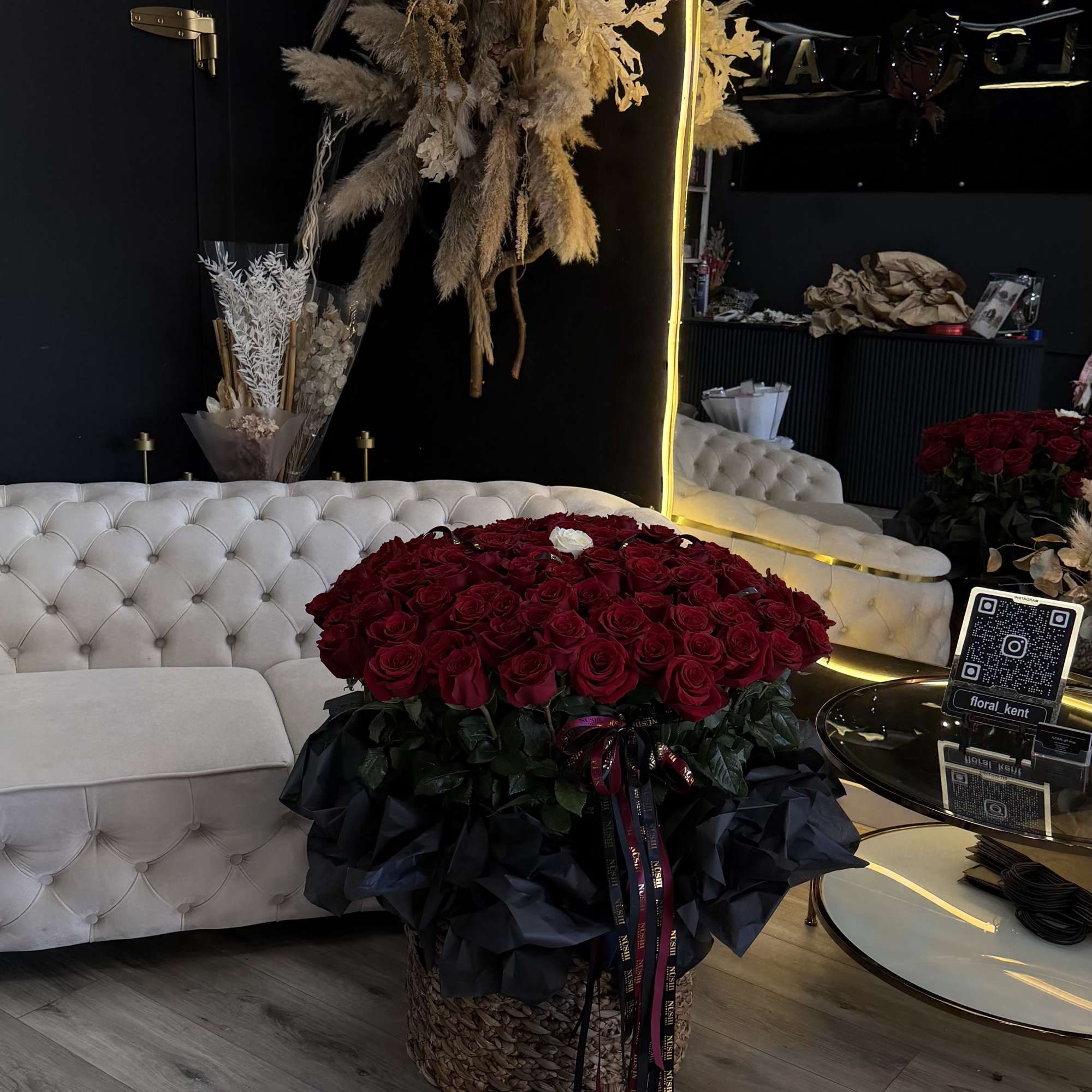 A luxurious XL basket featuring 101 premium red roses, beautifully arranged to