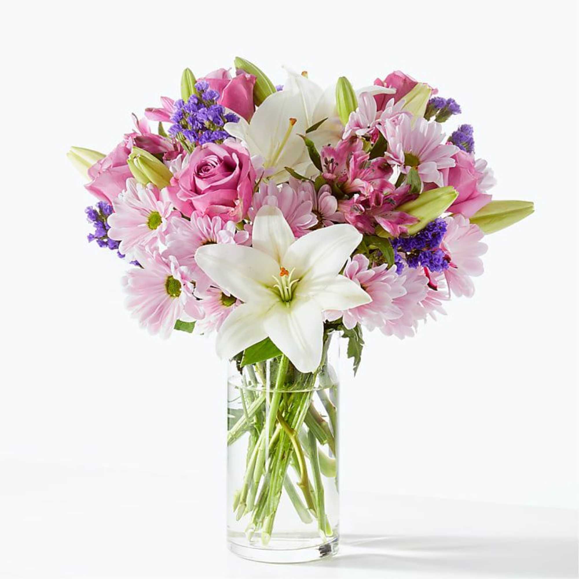 Pink and white mixed bouquet in a clear glass vase