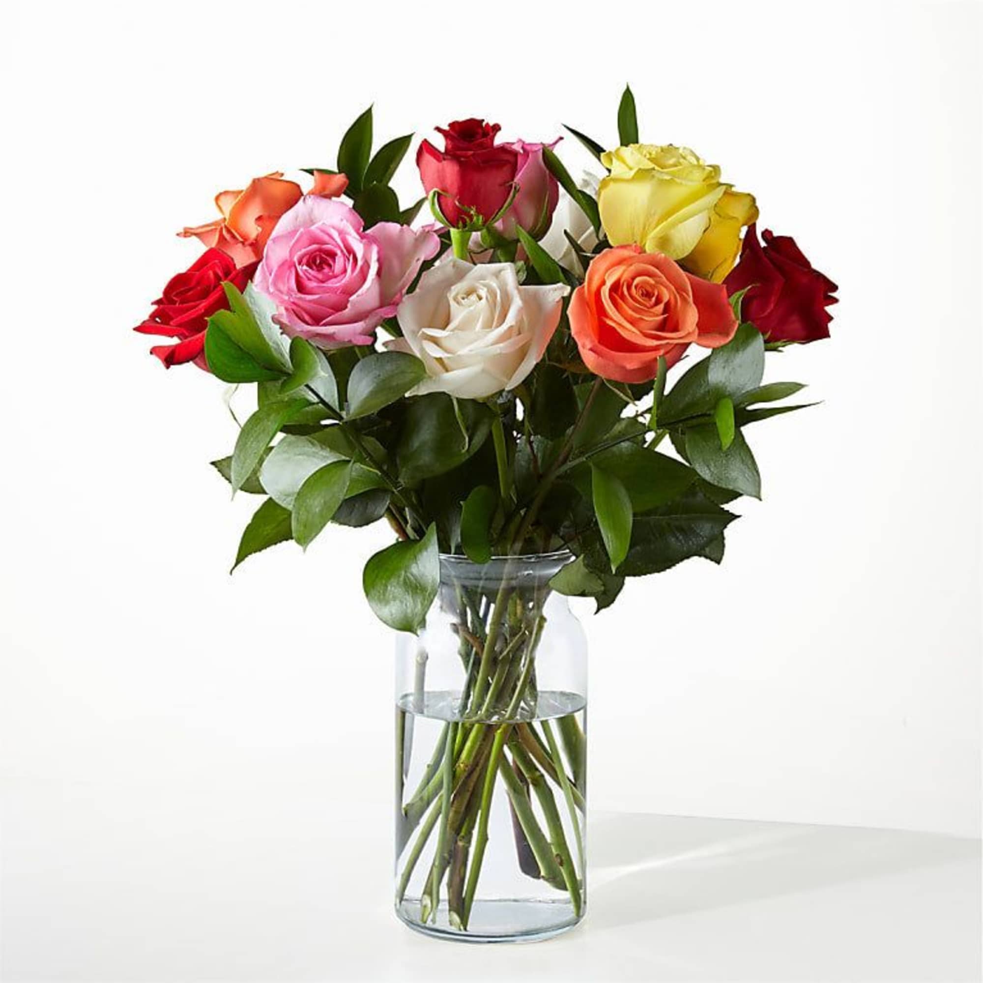 Mixed roses in a clear glass vase