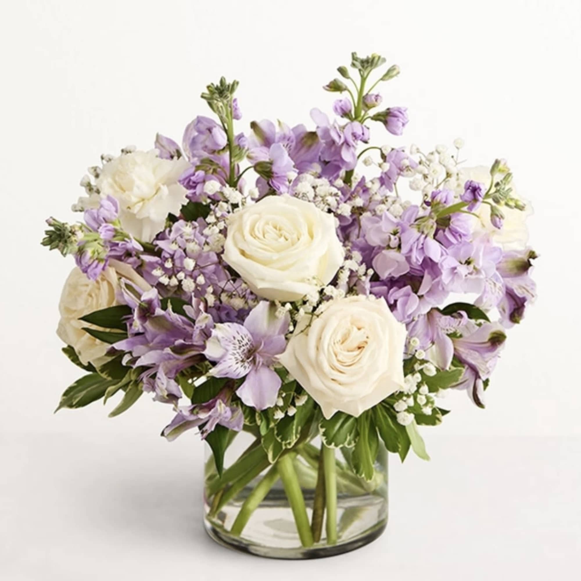 Lavender and white bouquet in a clear glass vase