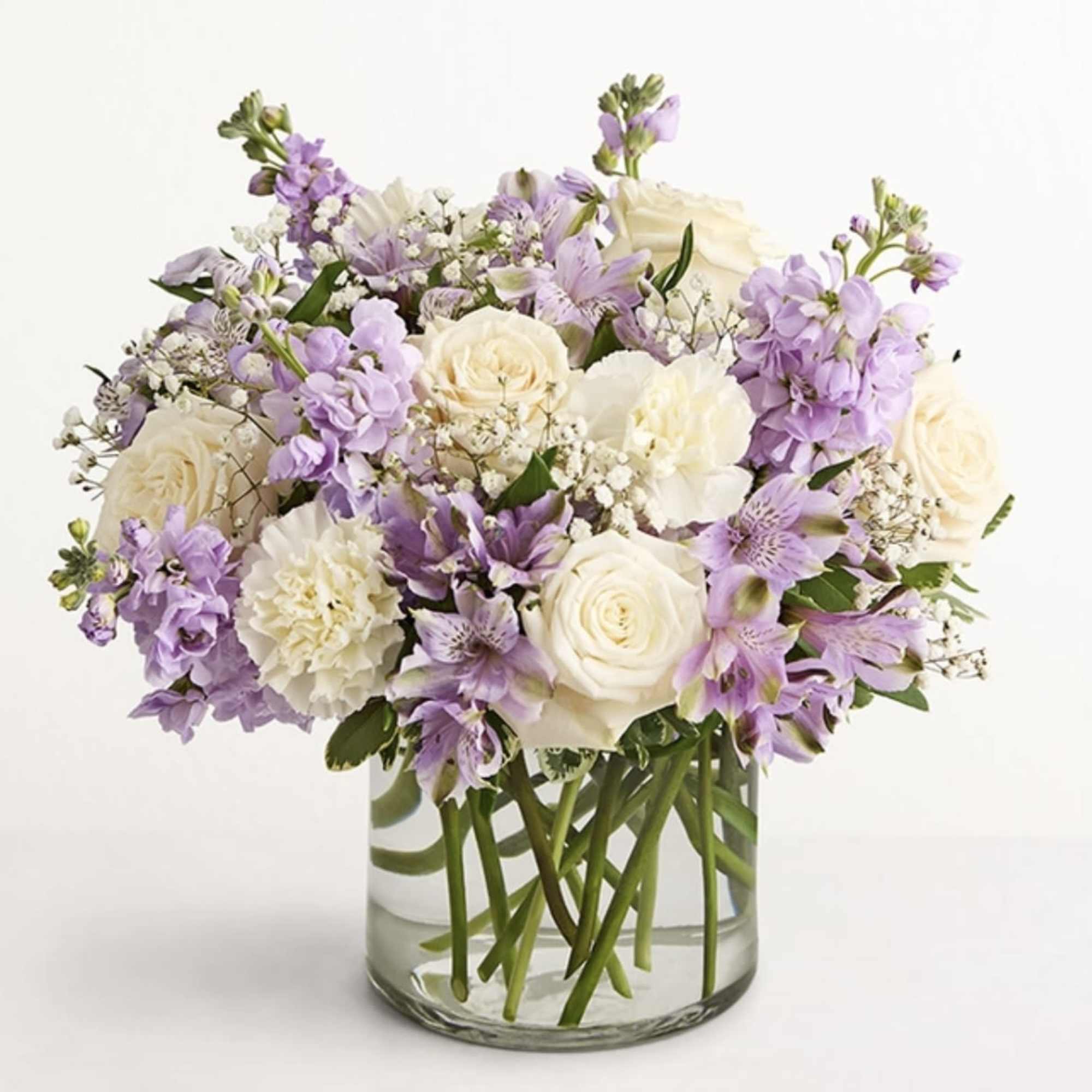 Lavender and white bouquet in a clear glass vase