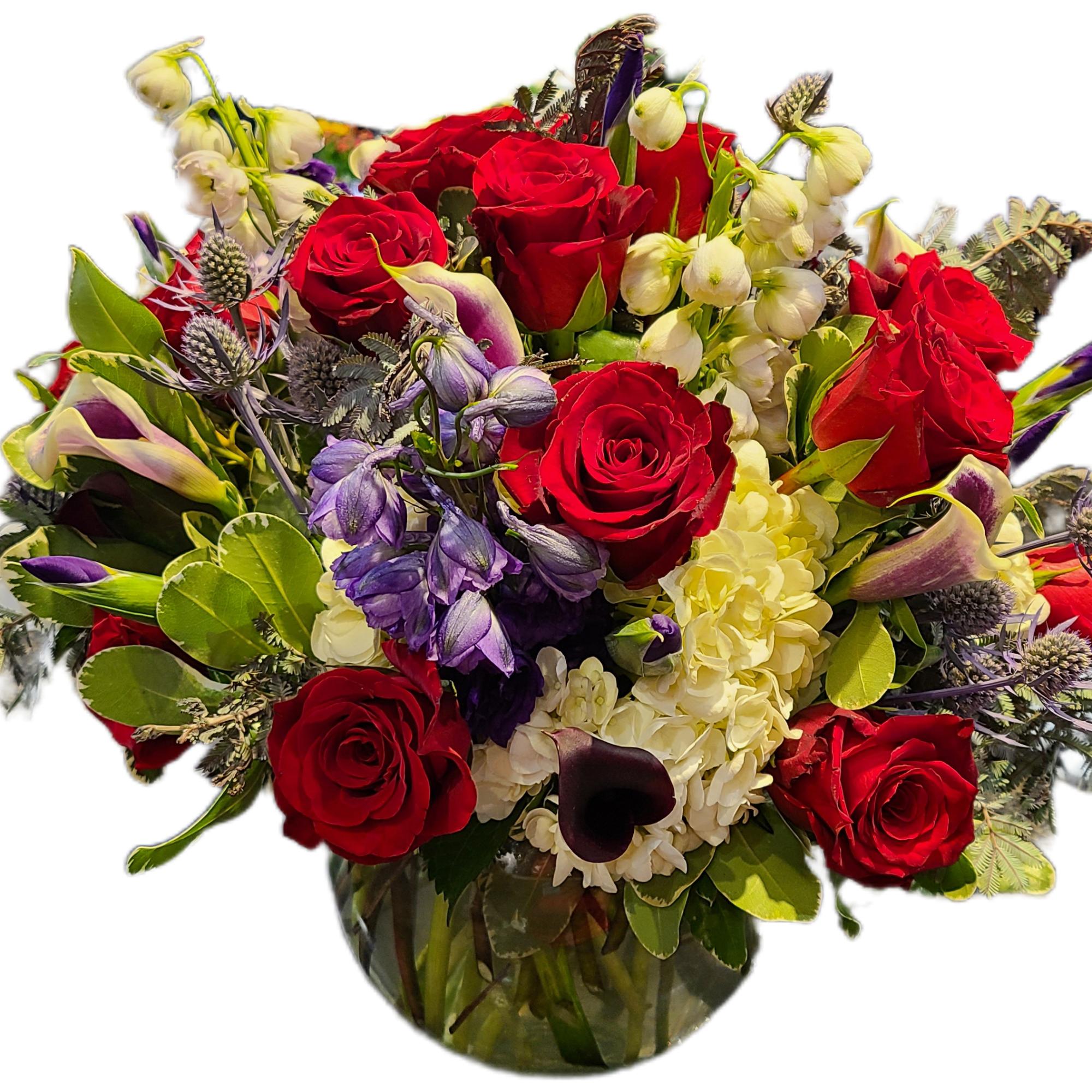 Custom arrangement featuring in season florals. All Custom orders please leave message