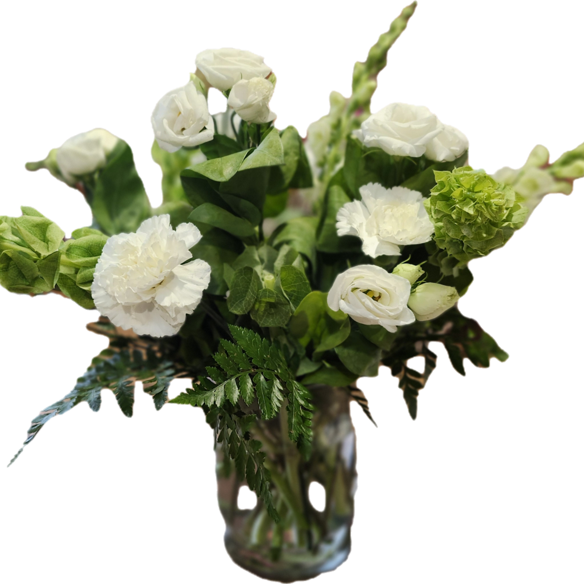 Beautiful white blossoms and shining greenery glow in this expertly crafted arrangement