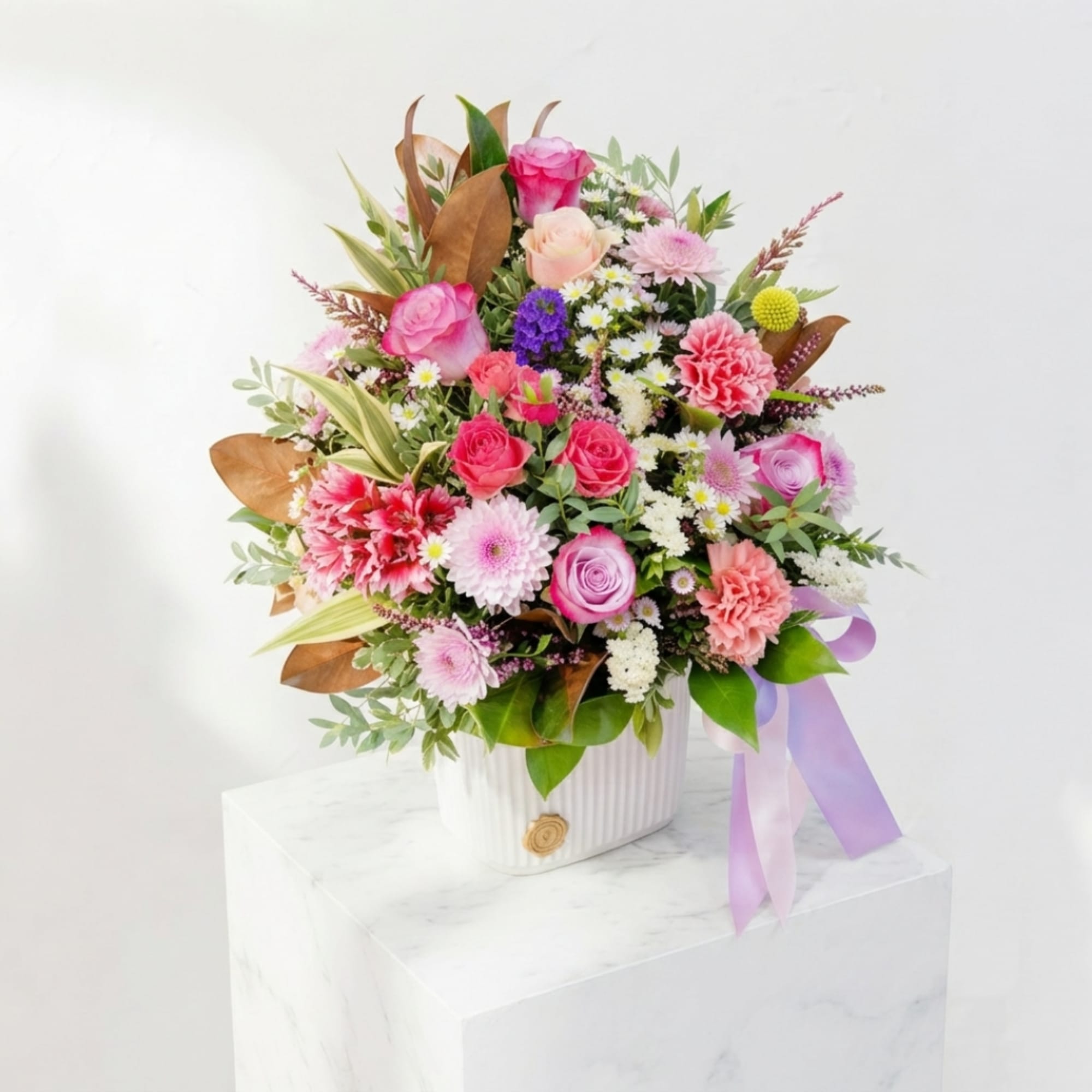 Mixed pink and white flower arrangement in a white vase with a lavender ribbon, photo 2 of 4