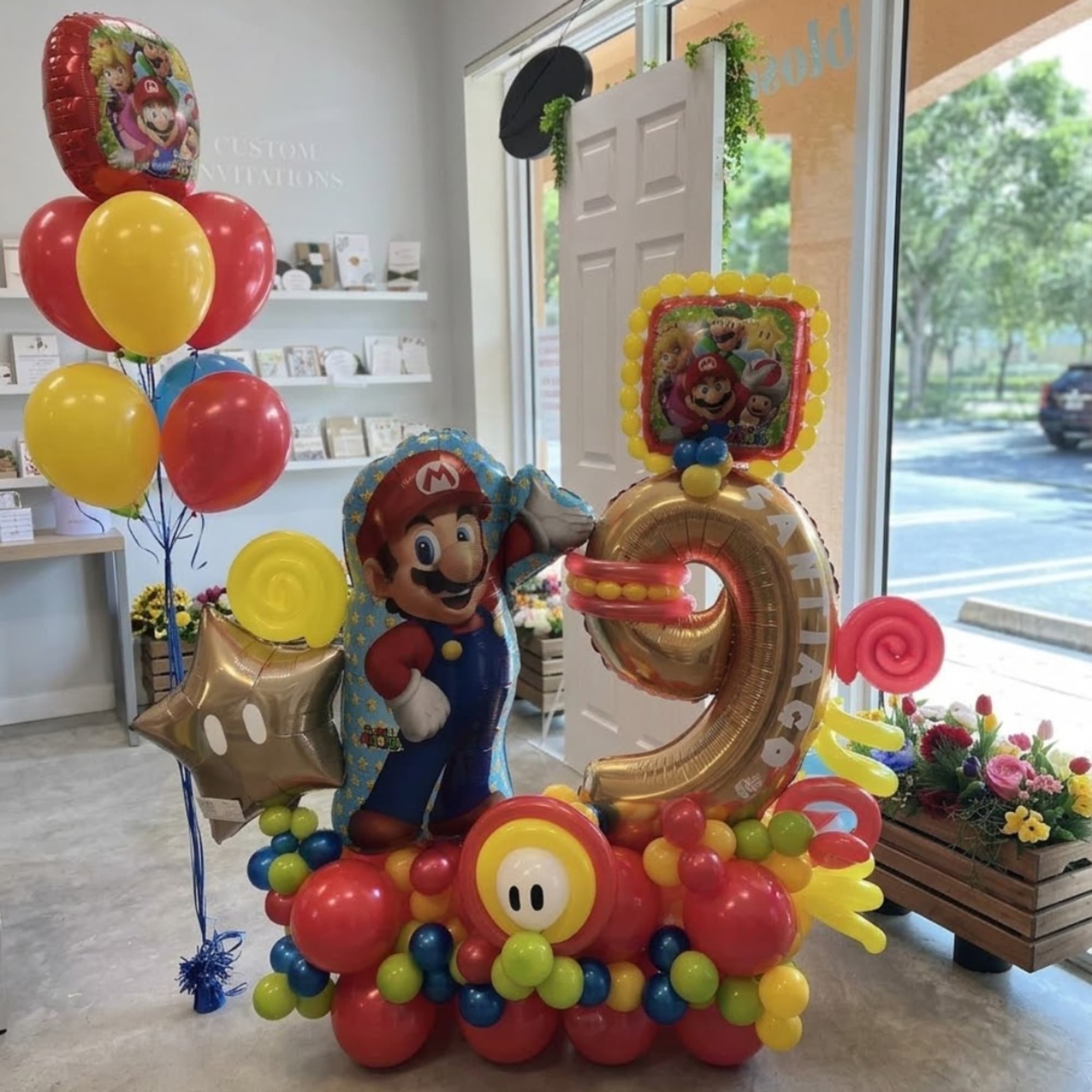 Mario-themed balloon display with a large number 9 and colorful balloons