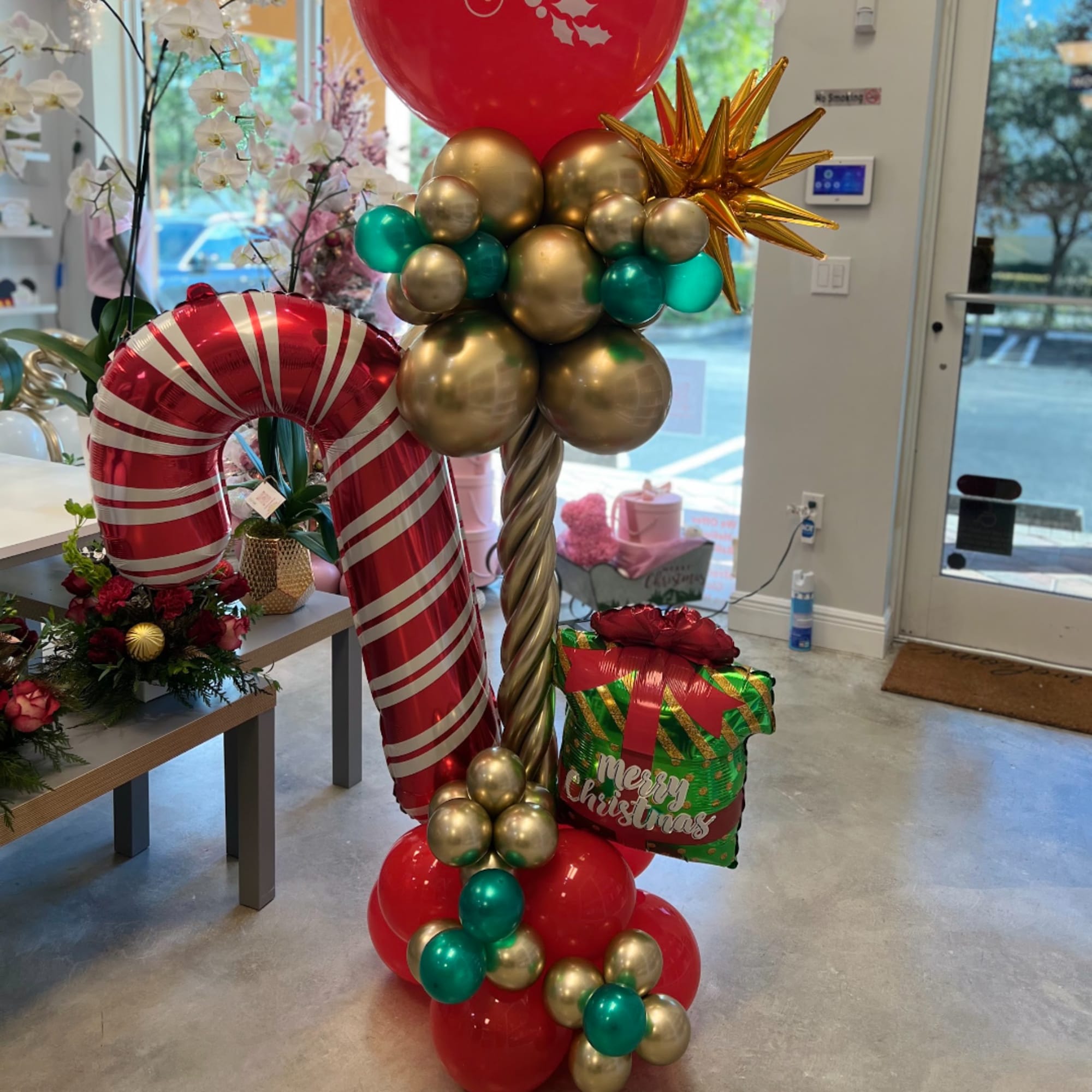 Christmas balloon display with a candy cane and gift box, photo 2 of 5