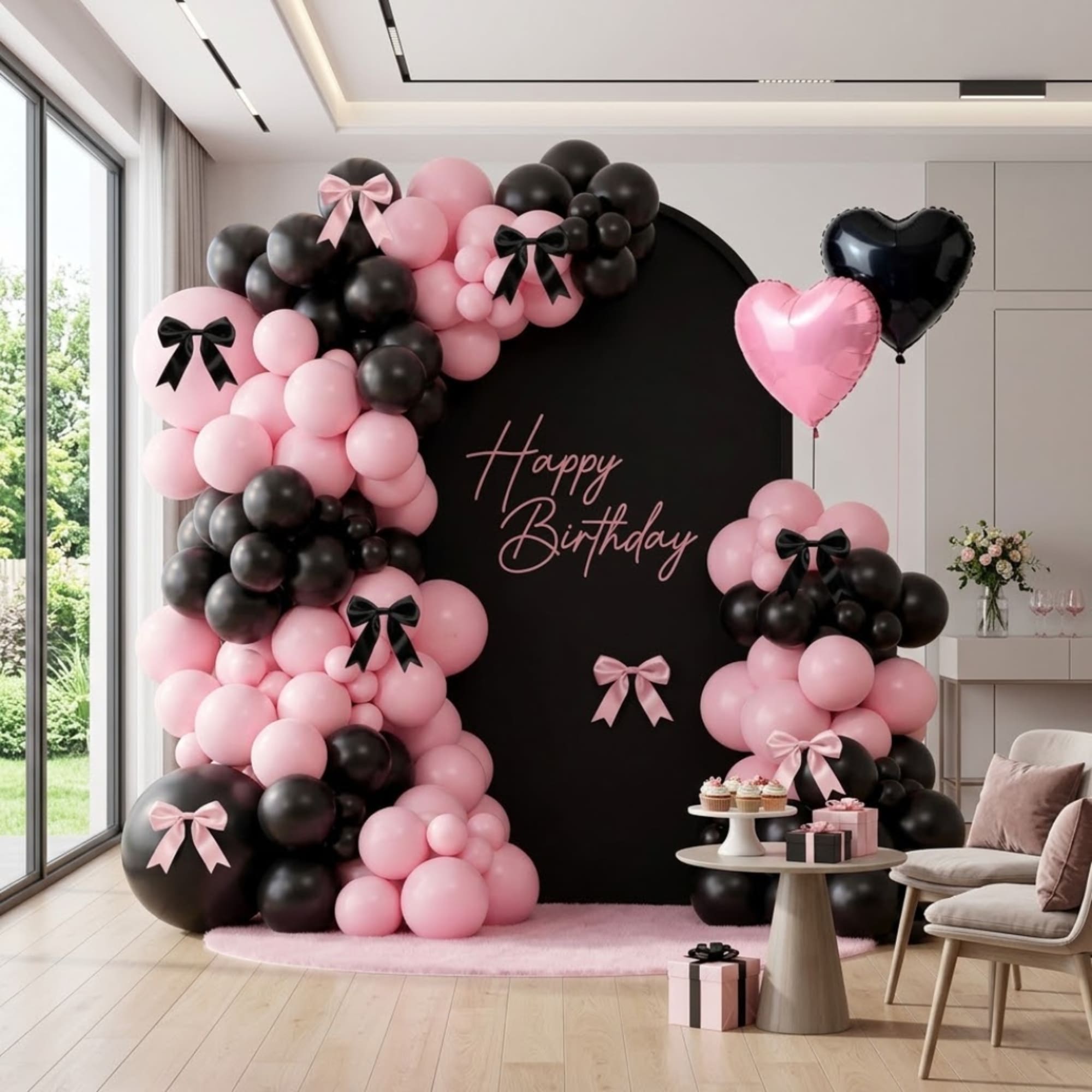 Pink and black balloon birthday backdrop with heart balloons and gift boxes