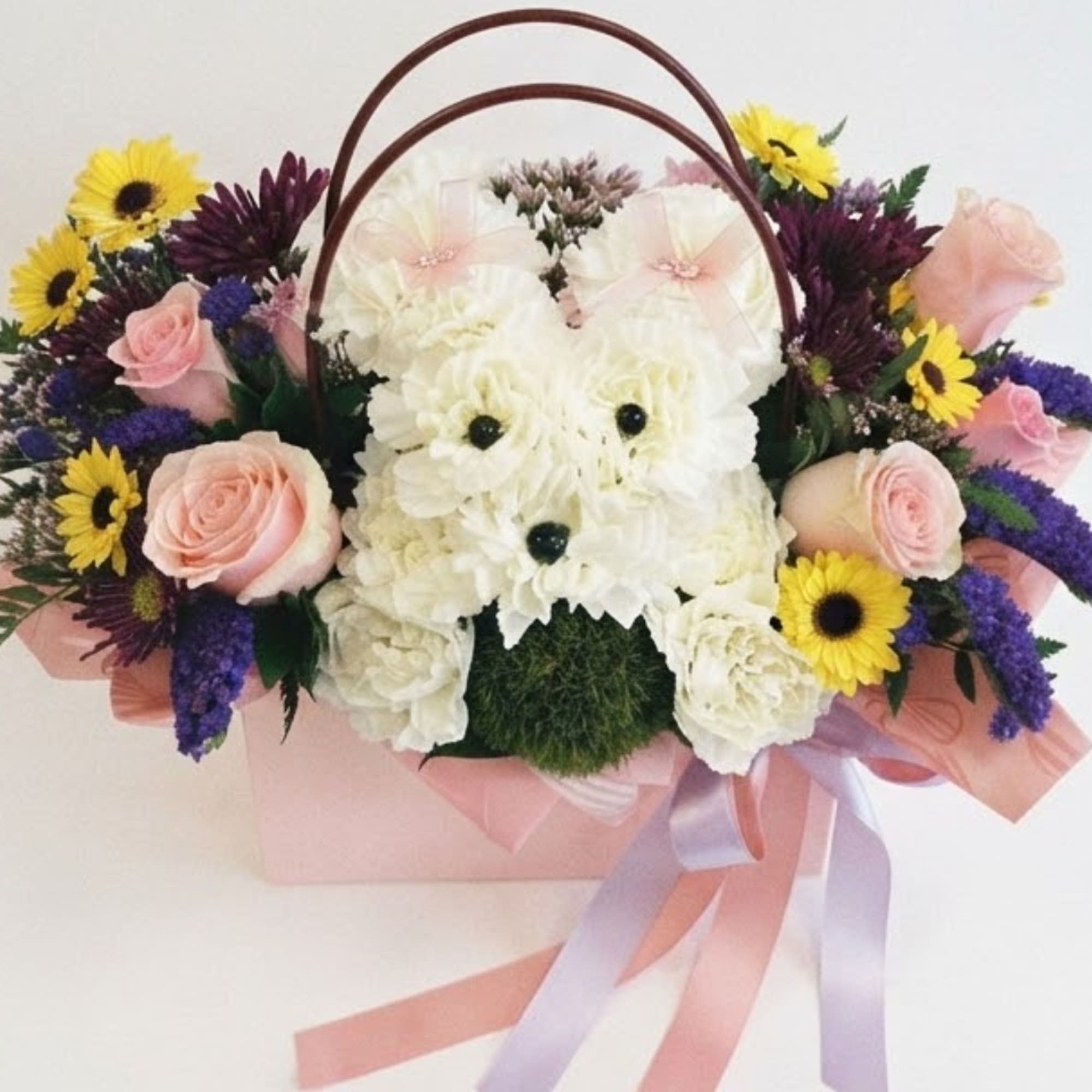 Flower basket arranged as a white dog with pink roses and yellow daisies