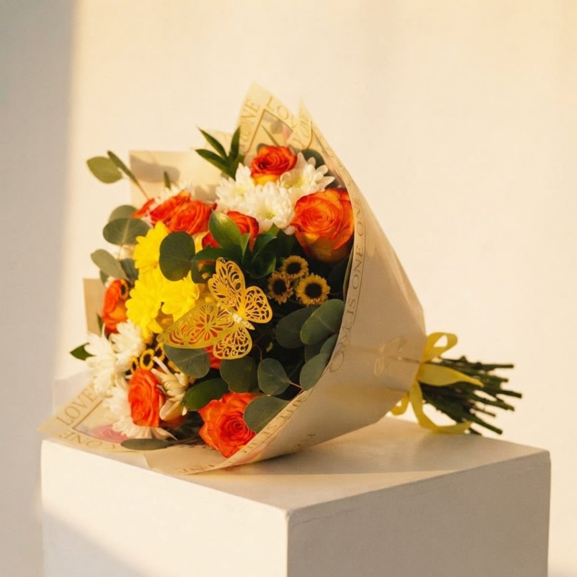 Bouquet of orange and white flowers wrapped in beige paper