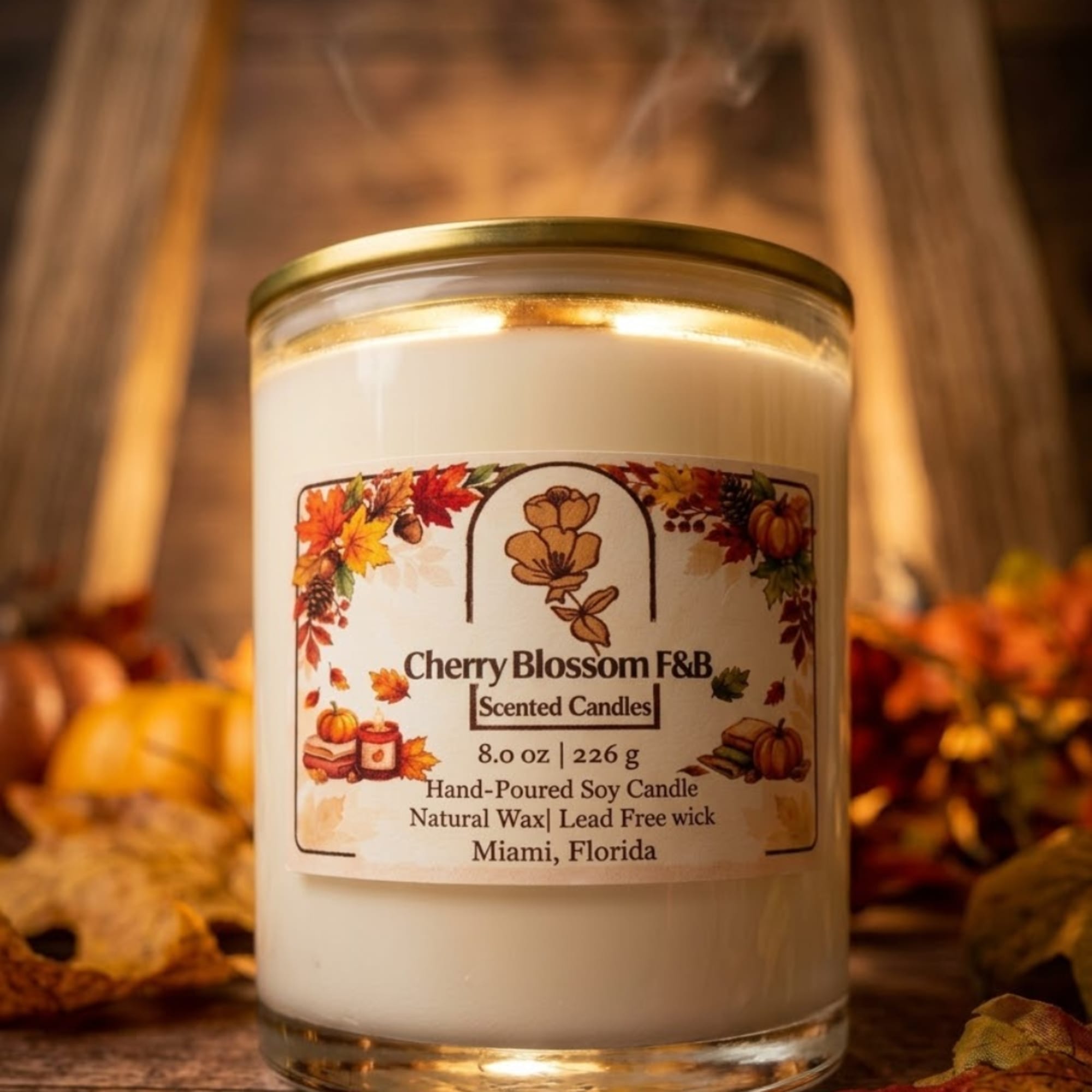 White scented candle in a glass jar with an autumn label